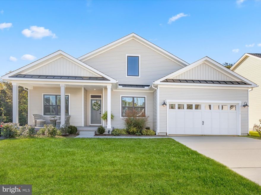 Why wait for the delays of new construction? Welcome to 32550 Morris Trail, a stunning 2024-built home nestled in the sought-after Ocean Meadows Community. Perfectly situated in a quiet cul-de-sac, this home offers a blend of privacy and community charm. Enjoy the serene backdrop of wooded treeline views from your elevated covered deck—an ideal space for peaceful mornings or lively gatherings with friends and family.

This home boasts a fully finished basement, perfect for a home theater, game room, or relaxation space. A separate unfinished section adds practicality, offering generous storage or potential for a hobby room, gym, or workshop.

At the heart of this home lies a chef’s dream kitchen, designed with entertaining and everyday functionality in mind. It features stainless steel appliances, gleaming Quartz countertops, a timeless subway tile backsplash, and soft-close white shaker cabinets. A large walk-in pantry complements the oversized island, which is beautifully accented by pendant lighting. The kitchen flows seamlessly into the dining area and living room, where custom blinds and luxury vinyl plank flooring tie the spaces together with style and ease.

The primary suite is a true retreat, complete with a spa-like Roman shower, dual sink vanity, and a spacious walk-in closet. The main level also includes two additional bedrooms—front-facing ones adorned with plantation shutters—a full bathroom, and a convenient laundry room with direct garage access. Every room is pre-wired for ceiling fans, ensuring comfort throughout the home.

Thoughtful upgrades include an irrigation system for a lush lawn, a smart thermostat for efficient climate control, and a tankless water heater providing on-demand hot water.

Ocean Meadows offers a wealth of community amenities, including a clubhouse with meeting spaces, lounge areas, a fitness center, and an outdoor pool, all within a pedestrian-friendly neighborhood. Just minutes away, the historic town of Lewes invites you to explore its charming boutiques, acclaimed restaurants, marina, and the pristine beaches of Cape Henlopen State Park. With convenient access to the Dart Beach Bus service, you’re also perfectly positioned to visit Rehoboth Beach’s boardwalk, Dewey, Bethany, and even Ocean City.

Whether you’re dreaming of a coastal getaway or your forever home, 32550 Morris Trail delivers on every level. Schedule your showing today and start living the coastal lifestyle!