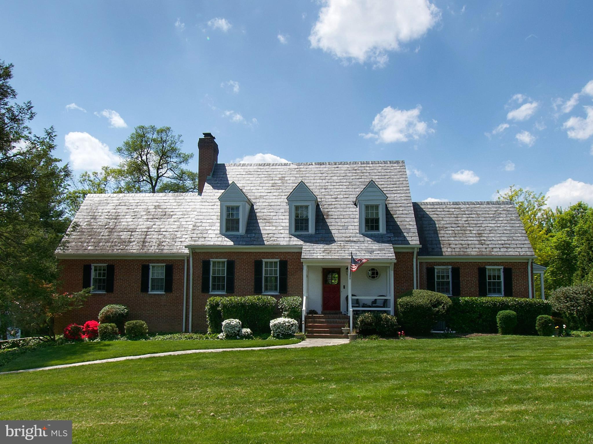 Opportunity is knocking to own a piece of cinematic history!! This stunning four-bedroom, four-bath, light-filled home with over 3500 sqft appeared in the movie Serial Mom and two commercials. Nestled in the heart of Fellowship Forest, it boasts panoramic golf course views and a large, flat backyard with a secret garden.
Inside, enjoy high ceilings, french doors from the spacious living room and dining room leading to a large patio, upper and lower patio ( redone 2021), and a screened porch (2024) off the primary suite. Enjoy remodeled bathrooms.(2018) and a remodeled eat-in kitchen (2022) and half bath offer modern convenience.
Upstairs, find two large bedrooms, with the potential to make a third large bedroom. One of the bedrooms has a cedar closet , with an extra storage room behind it. You are guaranteed to stay cool in this house with a new air conditioning system (2023).
The newly refinished lower level features stone composite flooring (2022) and includes a family room, office space, and a fourth bedroom with an en suite half bath. It even has an attached 2-car garage and room for 4+ cars in the driveway.
