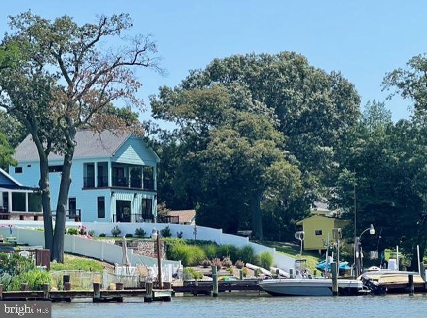 Exquisite waterfront new home, nestled in the desirable Rockwood Beach, serves as this builder-owner’s own private retreat, perfect for nightly sunset dinners on the deck or restful weekends in any season. Meticulously built, this 1,450 square-foot waterfront home offers brand-new upgraded fixtures, finishes, and systems in a modern layout for today's lifestyle. A cheery facade greets visitors hinting at the thoughtful design within. With an open concept floor plan, warm wood floors, and stunning chef’s kitchen anchored by a custom island, coming home to 1831 Cremen is a breeze. The expansive living room and dining spaces allows for easy entertaining with quick access to the back deck, patio, and sunshine. The main level is completed by a half-bath and large den that easily hosts overnight guests or a home office. 

Upstairs, the primary suite includes an en suite bath and glass doors to an incredible covered deck with retractable screening. The second bedroom with deck access, another full bath, laundry, and access to the conditioned attic space completes the bedroom level.

Outside, the 1/4-acre lot features a rebuilt bulkhead, parking pad, shed for water toys and equipment, and landscaping with native trees and shrubs.  Buyer will also receive permit-ready plans for pre-approved two-story garage and new driveway, along with preliminary plans for future private dock.  Exterior is creatively done with trex trim inlay in front to match porch, cover front porch with recessed lighting. Hardie plank siding done in three different patterns for custom look to the house.  All trim done with BORAL synthetic boards. All materials on exterior are rot proof and warrantied for 50 years, along with 35 year architectural shingles on roof, conditioned full height attic space with all plywood flooring, new high efficiency heat pump and whole house furnace located in the attic for easy accessibility. 

1831 Cremen Road offers tranquil living in Rockwood Beach. Enjoy community water privileges, supreme convenience to local marinas and restaurants, and an easy stroll to the fishing pier, boat ramp, and picnic facilities at Fort Smallwood Park. This is a must-tour to fully appreciate all the care and thought put into the home. It’s one-of-a-kind.