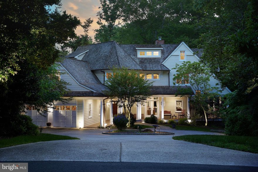 River House is a custom built (1997) residence perched just above the Potomac River, C & O Canal and Park in sought after Merry Go Round Farm.
The home boasts river and Park views from almost every room, as well as a deep wrap around covered porch overlooking the Potomac.
As you enter the home, you are greeted with a spacious foyer that leads to a formal living room with vaulted ceilings and panoramic views. The main level also includes a formal dining room, a large private office, an eat-in kitchen, two wood-burning fireplaces, a mudroom/laundry, and access to the 2-car garage. The highlight of the main level is the deep wrap-around covered porch that offers stunning views of the Potomac River.
The second level features the primary suite, three additional bedrooms, and a hall bath, all accessible by dual stairways.
The third level boasts a sitting area, two additional bedrooms, and a full bath. The walk-out lower level includes a rec room, a second living room, and a full guest suite complete with a bedroom, bathroom, and kitchenette.
River House sits at the junction of two trails, one winding over to MGRF section B through beautiful woods overlooking the Potomac River, and the other leading to the C and O Canal or up to the horse barns. The trail to the canal also takes you to a canoe shed; canoes are kept there for community members to enjoy.
The community offers three lakes, 8 miles of forest riding and walking trails, lighted tennis courts, on-site groundskeeper, equestrian center, two stables, and barn staff. The HOA covers lawn care and common areas.
Merry Go Round Farm was built on Drew Pearson's farm, an active horse boarding operation, and is a subdivision that values private space and community equally. The community also has a social committee that plans community events throughout the year, making this a wonderful place to live. 
River House is just minutes away from Potomac Village and excellent public and private schools. This home is a rare gem and a must-see for anyone looking for a luxurious and serene lifestyle.