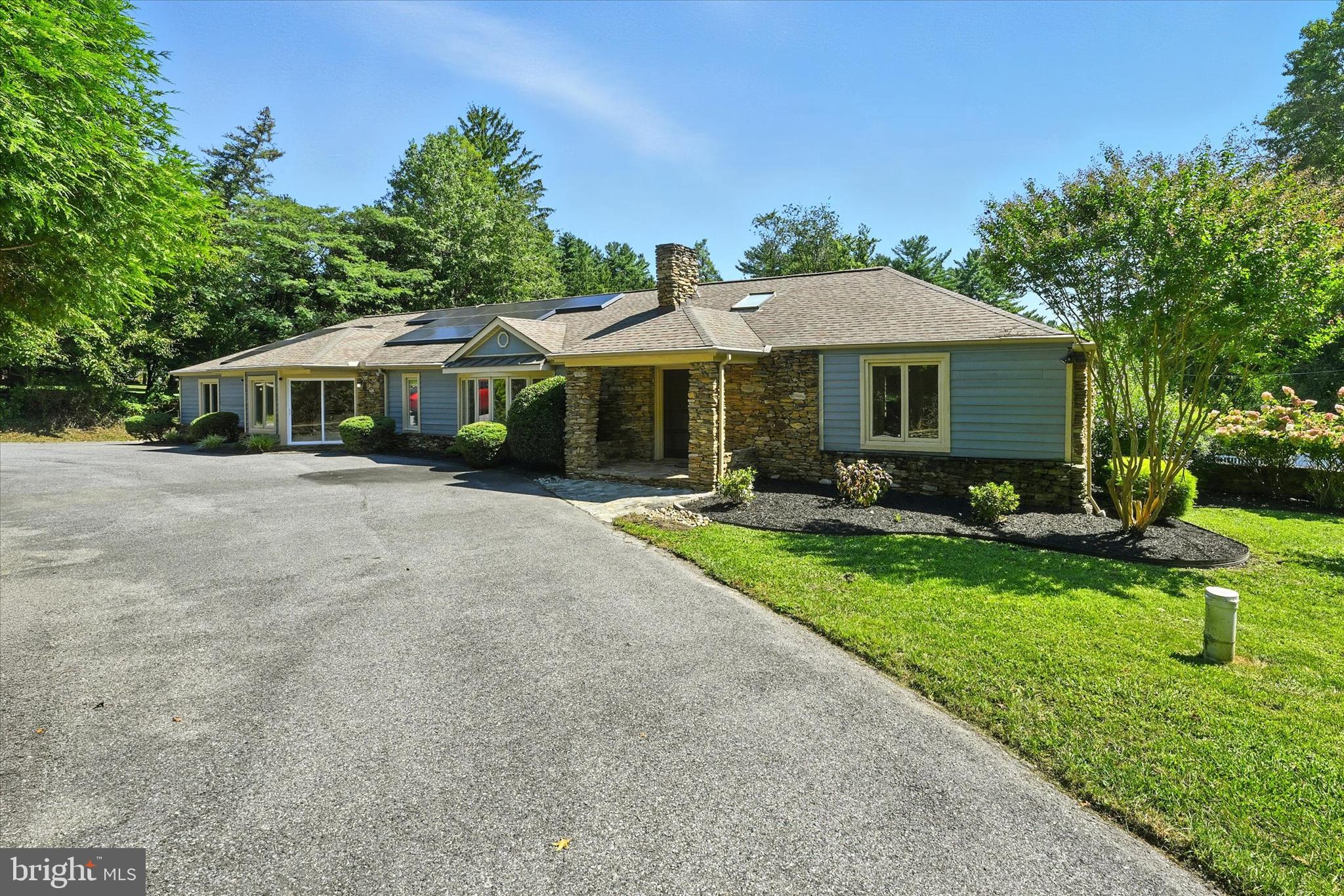 Welcome to 12325 Falls Rd! This immaculate 4-bedroom, 4.5-bathroom home in Cockeysville sits on nearly 2 acres and is filled with updates and thoughtful details throughout. Energy efficiency meets elegance with owned solar panels that cover up to 80–90% of utility costs, and fresh paint, new carpet, and ample natural light make this home truly move-in ready.
The main entry greets you with stunning marble floors and a double-sided fireplace, opening to a spacious living room with hardwood flooring and beautiful detailed molding. The kitchen features stainless steel appliances, an island with breakfast bar, skylights, and a bright dining area, while the formal dining room is accented with classic molding. A generous family room with hardwood floors and a guest half bath complete the main living spaces.
The main level offers 4 bedrooms, including a spacious primary suite with a sun-filled sitting area, large walk-in closet, and luxurious private bath with dual sinks, soaking tub, and separate shower. Two additional full bathrooms serve the remaining bedrooms, along with the convenience of a main-level laundry room.
The lower level provides even more living space with a large recreation room with new carpet, a full bathroom, and generous storage and utility areas. Outside, enjoy a freshly landscaped yard, expansive rear deck, and plenty of room to entertain.
With skylights, natural light, elegant finishes, and energy savings, this home is the perfect combination of comfort, efficiency, and style. Schedule your private showing today!