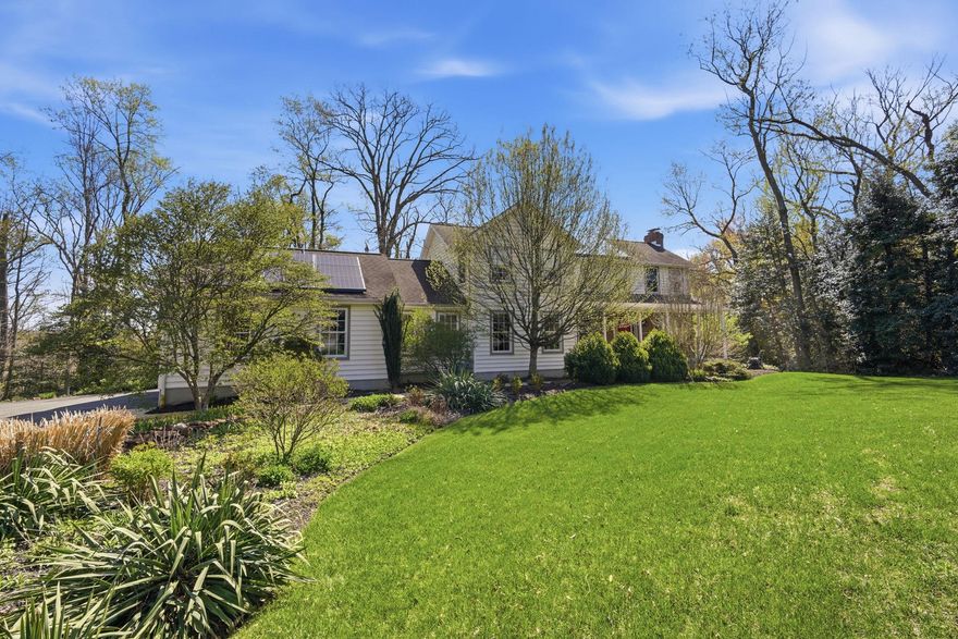 Well - maintained colonial home situated on over 12 + private acres along Piney Creek, complete with your own pier - perfect for canoeing, fishing or kayaking.  This 3 bedroom homes features an eat-in kitchen with marble countertops, opening to a spacious deck where you can relax and take in the peaceful wooded surroundings.  The main level also offers a cozy den with fireplace, a separate dining room, and a family room just off the the kitchen - ideal for everyday living and entertaining.  The unfinished walk - out basement provides endless potential for additional living space, a workshop or recreation area.  The property is beautifully landscaped with mature trees, creating a secluded setting.  A short walk or a fun gator ride takes you down a cleared path to the water's edge.  Located on a quiet street with only four homes, this is a rare opportunity to enjoy privacy, nature, and waterfront living all in one.