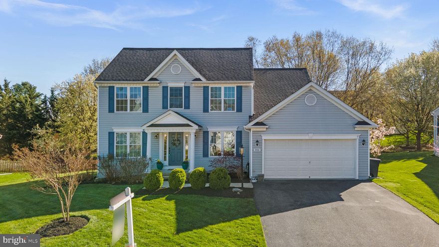 Charming and beautifully appointed Colonial residence offering 4 bedrooms, 3.5 bathrooms, and 2,918 finished square feet, complete with a 2-car garage in highly desirable Fields of Nottingham. This attractive home showcases exceptional curb appeal, highlighted by lush, manicured landscaping and a welcoming light-blue façade, accented by deep-blue shutters and crisp white trim.  // Step inside to discover an open-concept main level enhanced by recently refinished Brazilian Cherry hardwood floors that flow seamlessly throughout. The inviting foyer is flanked by a versatile formal living room or home office on the left, and an elegant dining room on the right, complete with classic chair rail detailing. At the heart of the home, the spacious family room features a cozy gas fireplace and opens effortlessly into a bright breakfast room with direct access to the outdoors. The adjoining gourmet kitchen is both stylish and functional, boasting stainless steel appliances, upgraded granite countertops, tile flooring, and a striking center island with a waterfall edge. Additional highlights include a built-in writing desk with an overhead wine rack, a pantry, a white subway-tile backsplash, and pendant lighting. A conveniently located powder room and main-level laundry room with full-size washer and dryer add everyday ease. Upstairs, you’ll find four generously sized, carpeted bedrooms and two full bathrooms. The serene owner’s suite impresses with soaring cathedral ceilings, a spacious walk-in closet, and a private en-suite bath featuring dual vanities, a corner soaking tub, and a separate shower. Two of the secondary bedrooms offer walk-in closets for ample storage. The fully finished lower level offers exceptional flexibility, featuring a spacious recreation area with new carpet and strong potential for an in-law or guest suite, There's room for a bedroom and full bathroom, plus a bonus space already wired and plumbed for a full kitchen, along with additional washer and dryer hookups. Recent updates include the roof and HVAC system, providing added peace of mind. // Outdoor living is equally impressive, with an expansive custom paver patio, a built-in fire pit framed by a stone retaining wall, and a fully fenced backyard complete with a storage shed—perfect for relaxing or entertaining. Residents of Fields of Nottingham enjoy access to resort-style amenities, including two outdoor community pools with a pavilion, optional swim club membership, tennis courts, picnic areas, and tot lots/playgrounds. Ideally located just minutes from historic downtown Mount Airy and with convenient access to I-70, this home offers the perfect blend of comfort, style, and accessibility. There is currently a home warranty from Cinch on the home that is transferable to the new owner.
Select photos include virtual staging for illustrative purposes only.