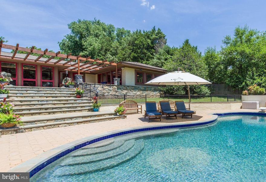 *NEW LISTING!* Welcome to QUERY MILL HOUSE a dream home inspired by the legendary architect Frank Lloyd Wright and masterfully built in 1996 by Scott Banks of the award-winning Banks Development Co for his own personal residence. This is the first time QUERY MILL HOUSE has ever been offered for sale to the general public, so don't miss this once-in-a-lifetime chance to own a true architectural masterpiece! Meticulously maintained with tasteful stone and wood accents throughout. Designed for the sophisticated buyer who enjoys relaxation, nature and entertainment. Perched up high on a prime 2 acre lot. Walls of windows and plentiful skylights fill this stunning home with abundant natural light. Enjoy both sunrises and sunsets from the intentional South facing orientation. Every room will "WOW" you! Highlights include a spacious gourmet "Le Cordon Bleu" chef's eat-in kitchen, open family room and an oversized stone patio with a custom shaded pergola that overlooks a pool, sports court and a lush private backyard. Lower level includes a private home theatre, billiards room, gym, sauna and plenty of bonus space for additional recreational use and storage. QUERY MILL HOUSE offers a close-in North Potomac location off River Road near Glenstone with easy access to Potomac Village, Downtown Bethesda, Pike & Rose, RIO, Kentlands, 495 & 270. Click on the virtual tour link for a high-tech 3D Tour! HURRY!! THIS WON'T LAST LONG!!!