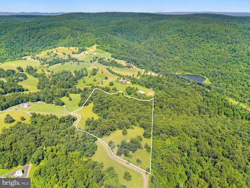 Private 21.36 acre parcel in Fauquier County.  Located in Apple Manor with spectacular Blue Ridge Mountain views.  A small dwelling exists on the property with well and septic.  Septic designed for a 4-bedroom home.  Many possiblities to build a primary residence or enjoy a weekend home.