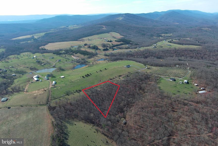 RURAL KING....3.6 ACRES OF COUNTRY BLISS IN BEAUTIFUL RURAL SETTING, YET CONVENIENTLY LOCATED WITHIN 10 MINUTES OF EVERYTHING ROMNEY. PEACE, QUIET & PRIVACY....BIG VIEWS, BIG HARDWOODS, LITTLE PRICE.....LOCATED IN A SMALL DEVELOPMENT KNOWN AS "HIGH MEADOWS" WHICH HAS BASICALLY BEEN IN SHRINK WRAP SINCE THE LATE 80'S.....APPROXIMATELY 40 LOTS WITH LESS THAN 15 OWNERS, NEIGHBORS HAVE GOBBLED UP VACANT LOTS OVER THE YEARS, LENDING TO THE PRIVACY AND UNDER DEVELOPMENT OF THE COMMUNITY. ELEVATED AT 1550 FT, THE LAND SLOPES GENTLY DOWN THE NORTH FACE OF THE HILL, RECLAIM THE FIELD AT THE TOP FOR AN AWESOME GARDEN AREA. EASY TO GET TO BUT HARD TO FIND, LESS THAN 1/2 MILE OFF THE PAVED ROAD. NO FORMAL HOA, ROAD DUES COLLECTED AS NEEDED.....MINIMAL RESTRICTIONS, DOUBLE WIDES ALLOWED....CAMP, BUILD, RV HOME BASE. A HECK OF A NICE LOT FOR UNDER 30K!