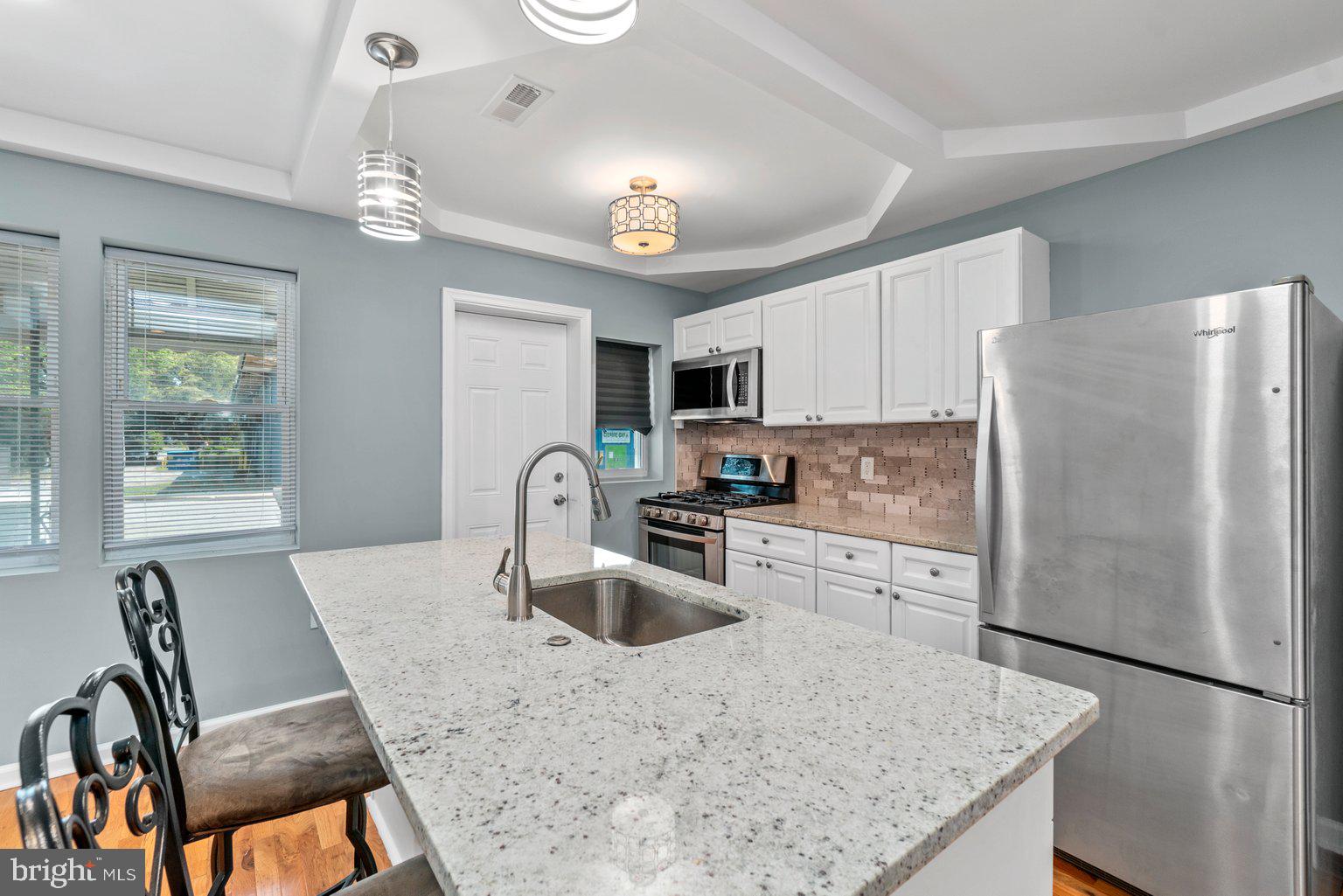 Another beautiful renovated home is now ready for a new home owner. This property includes an open floor plan, hardwood floors, tray ceiling, kitchen island, white kitchen cabinets, and new appliances. 3 bedrooms and full bath on the upper level, with another full bath in the basement. Enjoy living minutes away from Downtown Baltimore and nearby highways. This won't last long. Schedule a tour soon.