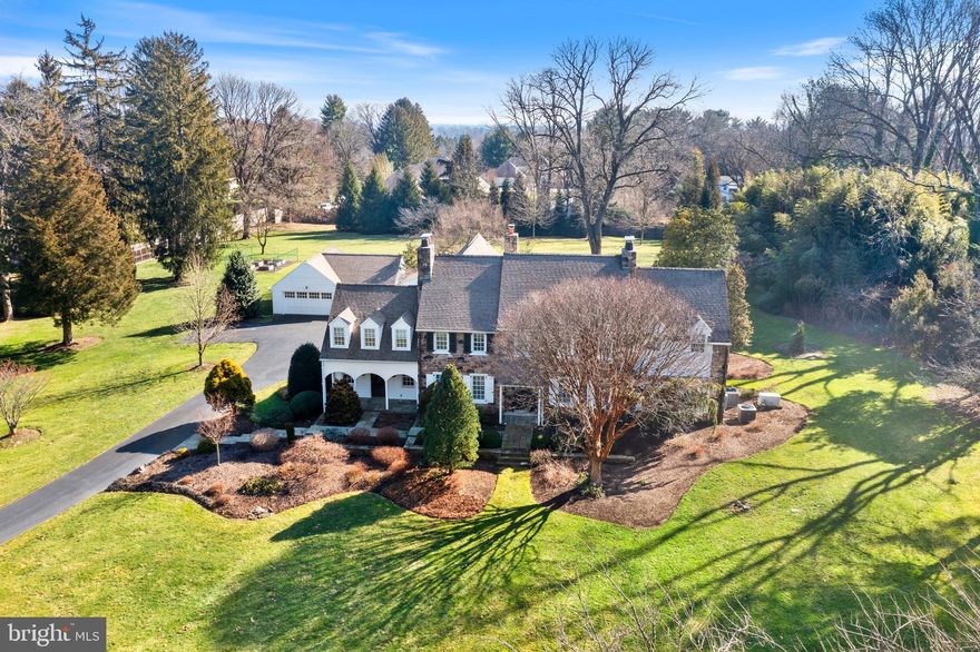 Location and Perfection combined -This home and property (2.65 acres) are PERFECTION! This classic Okie home dates back to 1928 with the DR and LR fireplace surrounds installed from a 1700's Doylestown home, random width pegged floors, large windows (all 55 of them have been replaced to match the originals) and other gorgeous architectural details. The current owner took great pains to increase the footprint to include 2 stunning family rooms, a gorgeous gourmet kitchen with dining area, a mudroom, separate office with exterior access, and primary suite with large bathroom and 2 walk-in closets.  There is also a wonderful finished basement that currently houses the gym with ample storage, a temperature controlled wine cellar and a large mechanical room with workshop area. The additions are of the highest quality and incredibly well appointed with built-ins in keeping with the original house.  The tall ceiling height throughout the house (soaring in the Primary BR) make the house feel spacious and bright and the wood floors in the additions match perfectly with the original flooring.  The Gourmet kitchen boasts a Wolfe range and oven, a second Bosch oven, the most beautiful honed granite counters with dramatic veins, quality painted cabinetry, two sinks, a bar area with wine refrigerator, a center island with Simon Pearce pendant lighting...it's truly stunning.  There are views of the sprawling level grounds out every window and the house is streaming with light in every room. There are also 3 different access points to back patio creating a wonderful indoor/outdoor flow. The grounds include an expansive front, side and rear lawn, specimen plantings, raised beds with an irrigation system, an outdoor shower along with a concrete pad and plumbing for a hot tub and a large gorgeous slate patio with portico that includes uplighting, a ceiling fan and beautiful dark wood ceiling.  There is also a 3-Car garage.  This house is truly spectacular. It is perfect for the discerning buyer who is looking for privacy, the highest quality throughout, and the perfect blend of old and new - offering every convenience of a newer home.  And, of course the location can't be beat - it's in the coveted and convenient Borough of Rose Valley, a short distance from 2 SEPTA train stations (25 min ride to Center City), a 12 minute drive to the Philadelphia International Airport and more! Houses of this caliber do not come available often!