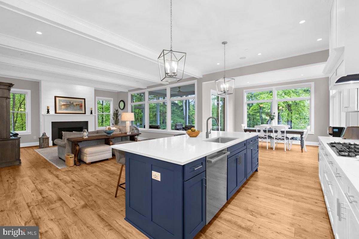 Live the waterfront lifestyle you’ve always dreamed of—situated in coveted Severna Park. Nestled on a private .81-acre lot, this stunning 6BD, 5BA home offers over 5,300 square feet of refined living space with sweeping water views and nature.
Start your mornings with coffee on the screened porch as the birds serenade you, and end your day with a sunset boat cruise launched from your private pier—complete with a boat lift, jet ski lift, and durable, low-maintenance WEARDeck boards.
Inside, luxury abounds. Soaring 10-foot ceilings, wide-plank luxury flooring, and expansive windows create an airy, sunlit atmosphere. The chef’s kitchen features Bosch appliances, double ovens, quartz countertops, a walk-in pantry, a beverage station and a custom range hood—perfectly positioned to flow into a dining space with panoramic water views. It’s an entertainer’s dream, ready for your next gathering.
Hosting long-term guests or need space for multi-generational living? The fully finished walkout basement includes a second kitchen, laundry area, a second home office, and the 5th bedroom—ideal for an au pair or in-laws.
The spa-like primary suite is your private retreat, complete with a soaking tub, walk-in shower, and custom California closets. Guest rooms feature en suite or dual-vanity baths to ensure comfort for everyone.
Work from home? No problem! The main level has an office OR can be used a 6th bedroom.
Thoughtful upgrades include a 22kW generator, surround sound system, smart home features, 3 HVAC units, remote-controlled window treatments, and upgraded insulation throughout. Every detail has been designed for comfort, function, and luxury.
This is waterfront living at its finest. Come experience it for yourself.
