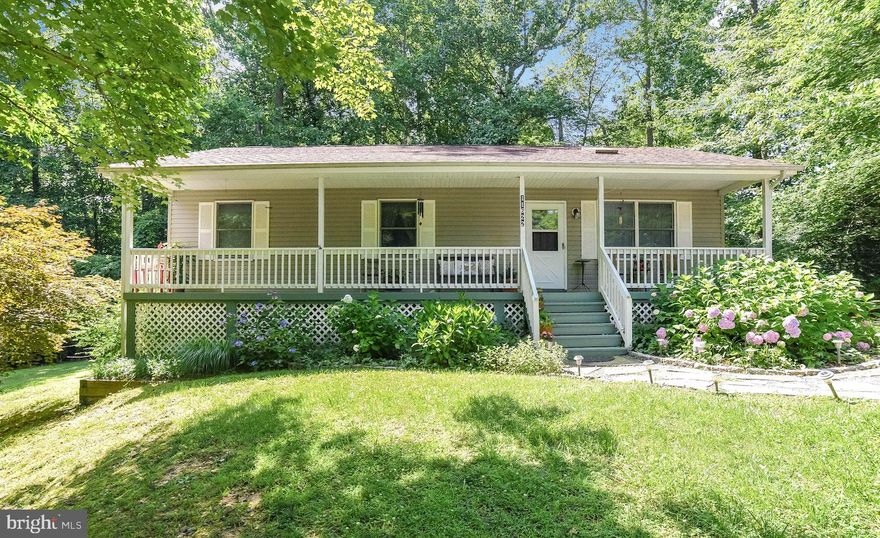 Welcome home! This lovely 3 bedroom/2 full bath home has been well maintained and pride of ownership shows!  Newer carpet and paint not to mention beautiful cherry hardwood floors in kitchen and sunroom.  Skylights in family room and sunroom add nice natural lighting.  Sunroom leads to private park-like setting with level fenced back yard.  Neighborhood amenities include two sandy beaches on the Chesapeake Bay, a man-made lake for swimming and fishing, campground, private garden plots, hiking trails and even a private airpark.  Conveniently located near restaurants, shopping and easy commutes to Dominion and Calvert Cliffs.  Large walk-in crawl space for great storage area. You won't be disappointed in this move-in ready home.  Call today for appointment!