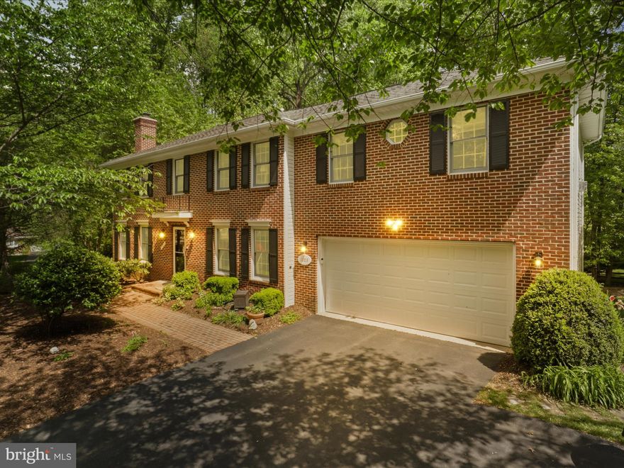 Beautifully Updated 5-Bedroom Colonial in Sought-After Langley School Pyramid – Just 4 Miles from Tysons Corner! Welcome to this stunning, thoughtfully updated 5-bedroom home, tucked away on a quiet cul-de-sac in the desirable Wolf Trap Green community. Perfectly situated in the Langley High School pyramid, this home offers the ideal blend of space, style, and location. Step inside to a classic center-hall colonial layout with a formal living room to your left and a warm, inviting family room to your right—complete with elegant built-ins. The gourmet kitchen is a chef’s dream, featuring a center island, granite countertops, and stainless steel appliances including a Wolf Oven. Just off the kitchen, the screened-in porch offers the perfect retreat to unwind with a drink while enjoying views of the expansive, tree-lined backyard. Prefer to grill? Head to the adjoining deck, ideal for summer BBQs and outdoor entertaining. Upstairs, you'll find five spacious bedrooms and a convenient laundry room. The expanded primary suite is a true sanctuary, boasting a cozy sitting area, gas fireplace, tray ceilings, a large walk-in closet with custom organizers, and a luxurious spa-like bath with a frameless glass shower and soaking tub. The fully finished walk-out basement adds even more living space, featuring a large rec room with fireplace and a versatile bonus room—perfect for guests, a home gym, or hobby space. Additional highlights include: gleaming hardwood floors, crown molding, built-ins, Elfa closet systems, updated lighting, new carpet, and so much more. All of this, just minutes from Tysons Corner, Metro, Wolf Trap National Park, and Reston Town Center, in a welcoming and vibrant neighborhood. Zoned for Colvin Run ES, Cooper MS, and Langley HS, this home truly has it all. This is the one!