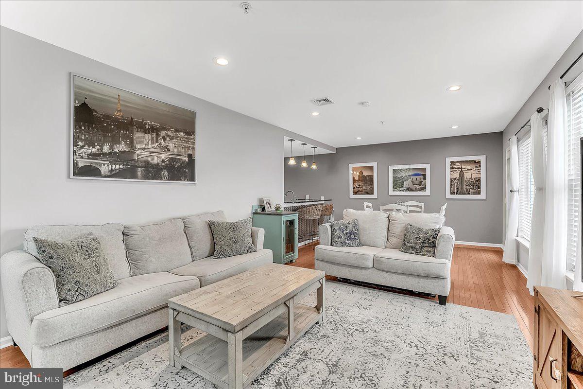 Beautiful 2 large bedroom, 2 full bathroom available with private GARAGE PARKING in the highly desired neighborhood of Northern Liberties and steps away from historic Old City. Enjoy breathtaking views on your private patio overlooking the river and the walkability of this convenient location. Upon entry you will find a full size high efficiency washer and dryer in unit and closet storage space. The first bedroom is at the end of the hall with it's very own en suite bathroom, walk in closet with organizer and ceiling fan. Around the corner and into the updated kitchen is the heart of the home with tons of natural light pouring in from all angles. The kitchen features granite countertops, backsplash, custom cabinet lighting, stainless steel gas range and a breakfast bar. Recessed lighting in the main living space adds that extra illumination. Gorgeous hardwood floors span the living room. Around the corner you will find the other bedroom and full bathroom. There is an additional private storage room in the lower level garage. At this location you are only 1 block from the train station for quick, easy commuting and a very short walk from the brand new Sprouts supermarket.