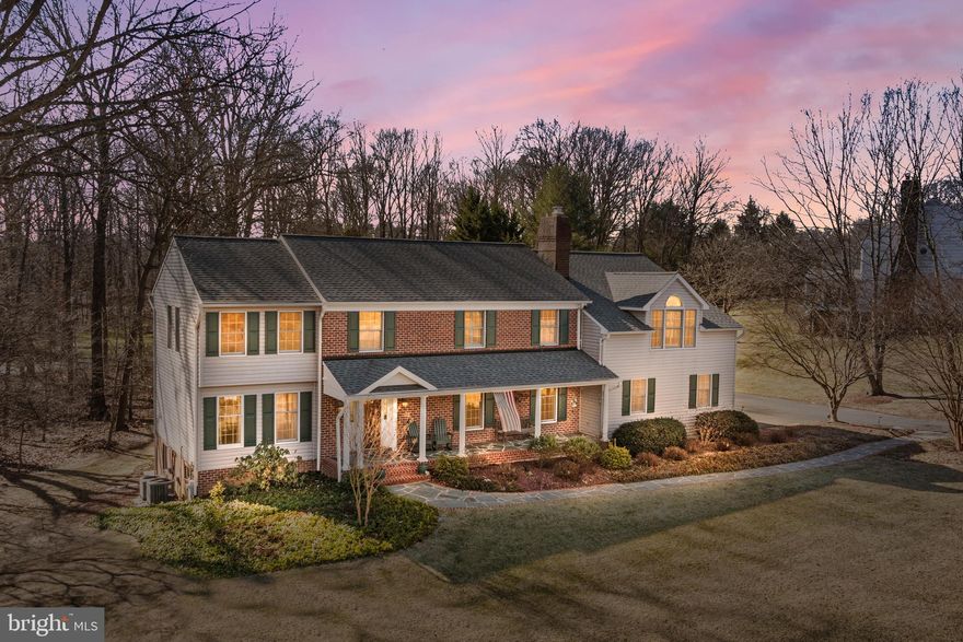 NEW PRICE!! Tax SF incorrect.  Corrected square footage is 3793.  This home has been expanded in three different areas of the home creating a much larger footprint than is noted in the taxable square footage.  Nestled in Phoenix’s Millgate community, this meticulously maintained and expanded colonial offers a comfortable living experience with great curb appeal. The first feature you will enjoy walking up to the front door is the meandering stone and brick path from the driveway to the front porch surrounded by beautiful landscaping.  The front porch stretches across the front of the home with columns, flush mounted lighting and a birds egg blue ceiling. The front door is solid wood and is set between two custom carriage porch lights. This home boasts 4 - 5 spacious bedrooms and 5 ½ baths. The primary bedroom is oversized and includes built in book shelves, a bump out window nook, a large walk in closet, and an oversized en suite bathroom with a custom walk in shower, a jetted soaking tub and a double sink vanity with a quartz counter top.  In addition to the primary bedroom having an ensuite bath, two other bedrooms upstairs have en suite bathrooms.  A hall bath is also on the second floor next to the laundry room. No more hauling laundry baskets up and down the stairs! This home features an upstairs laundry room, perfectly situated for easy access from the bedrooms. The fifth bedroom is attached to the primary bedroom and is perfect for a nursery, dressing room, or a home office. Throughout the home, you'll find oversized bedrooms and living areas that create extra space and comfort in every room. The first floor has beautiful hardwood flooring that was refinished in 2018. Whether you're entertaining guests or enjoying a quiet evening at home, the expansive layout offers flexibility and comfort. The heart of this home is the custom kitchen which has been meticulously designed with the culinary enthusiast in mind. Adorned with high end appliances including a gas cooktop, beautiful cabinetry, and granite countertops, this kitchen is a chef's dream. The morning room off the kitchen provides the perfect oasis for casual dining, with large windows that offer scenic views of the backyard. A huge deck beckons you to enjoy outdoor living at its finest. Overlooking the gently sloping back yard, this deck is perfect for barbecues, al fresco dining, or simply relaxing with a book. The well-maintained yard provides plenty of space for play and gardening, making it an ideal retreat for both adults and children. Next to the kitchen, the large open great room is ideal for both relaxation and entertainment, featuring a stone surrounded gas fireplace and built in bookcases that add ambiance and warmth. Adjacent to the great room is a half bath, conveniently located for guests. The huge dining room spans the depth of the home from front to back, providing an elegant space for hosting dinner parties and family gatherings. Coming in from the 2+ car garage, you'll find a practical mud room that helps keep your home organized and clean. With built-in storage and durable flooring, this space is perfect for storing shoes, coats, and outdoor gear. The garage features two doors for cars and a large storage area. Also included in the garage is a workbench. The lower level of the home is finished, including a full bath, and offers additional living space that can be customized to suit your needs. With carpeting, built-in shelving, and a walk-out to the backyard, this area is perfect for a family room, in-law suite, or home gym. Situated on a no thru street, this home offers tranquility and privacy while being conveniently located near local amenities. Millgate is known for its friendly community atmosphere, excellent schools, and easy access to shopping, dining, and recreational facilities. Updates include HVAC 2023 and 2024(two zones), gas water heater 2024, roof 2024, carpet 2020, refinished wood floors 2018, gas fireplace 2023.