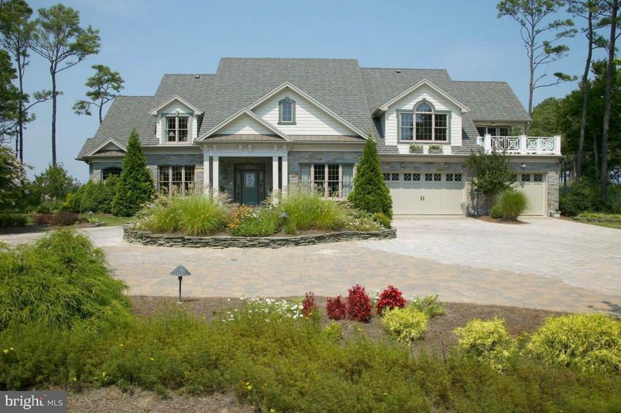 A timeless classic situated on more than 3 waterfront acres, this home offers dramatic, marsh fringed views of the Assawoman Bay and the Ocean City skyline beyond. The recreational boater will appreciate the private lit pier with boat lift, water and electric. The interior is a masterful combination of form and function, sparing no details. An open floor plan, chef's kitchen, second floor entertainment area, formal and intimate dining room as well as attention to detail with a creative mix of plaster molding, arched niches and beamed ceilings through-out the home.