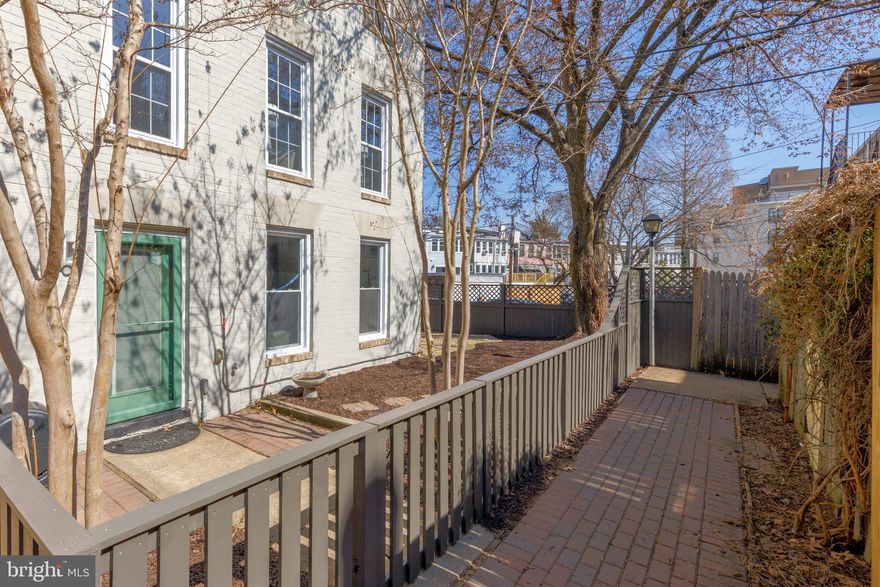 Seeking a unique home with European vibes, privacy, parking, and proximity to public transit, as well as restaurants, and groceries? Look no further, 1511 Freedom Way SE is it! This quiet (bricked) alley home sits on a large (approx 2300 SF) lot nestled in the trees and has a "secret" walking entrance onto Pennsylvania Ave. SE!

The flexible interior layout offers so many possibilities. You will be charmed by the beautiful Chef's kitchen, with island seating for 4, casual dining area, built in buffet, fireplace, and powder room on the first floor. The second level boasts a living room bathed in light that is perfectly suited for that comfy sectional. A full bath and large bedroom/office/den completes the second floor. The third level offers two more bedrooms and another full bath - don't miss the walk-in closet!

Outside is a wonderful compound with a new fence, surrounding patio/parking and gardens. The front and back gardens come alive with native plants in the spring and the crepe myrtle trees are awash in color in the summer. This home is steps from Potomac Ave metro, Congressional Cemetery, and Anacostia River trail (leading to the Yards Park and ballpark on one end and the Fields at RFK, Heritage and Kingman Islands, and Aquatic Gardens on the other end).

In bounds for the Capitol Hill Cluster Schools (Peabody Pre-K-K, Watkins Elementary and Stuart Hobson Middle School.  Owned solar panels make this all  electric home modern and efficient!