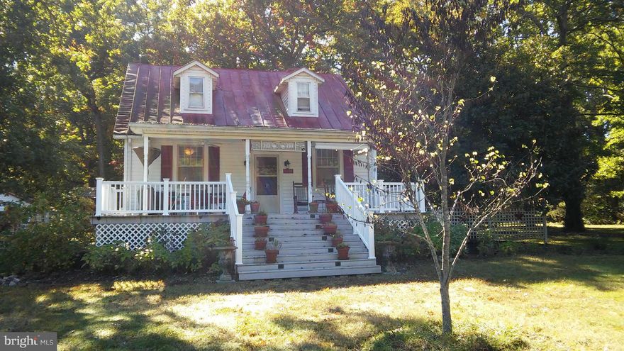 Lovely(almost 6 acres!) farmette waiting for you!  workshop with floor, pergola, barn, chicken yard, orchard, garden, built in cabinets, built in shelving, extra large covered front porch. Not far from 95. Own your piece of the country today!