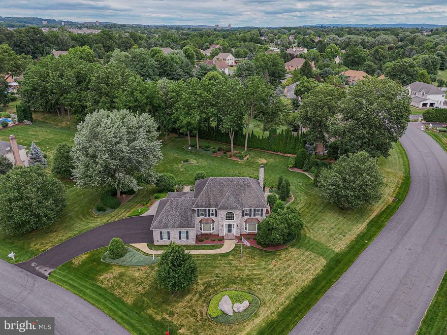 Pride of ownership is evident in this stunning Ridgeview Estates 4 bedroom Colonial set on nearly an acre in the heart of Nazareth School District. This meticulously maintained home of over 3000 sq feet features a lushly landscaped back yard that is private and serene. Perennial and vegetable gardens accent slate and paver patios from which one can view the park-like setting beyond. Hardwood floors grace much of the main level and numerous windows provide plenty of light. The living room, dining room and breakfast area all have bay windows with beautiful views and the family room with a stone gas fireplace offers a cozy space for reading or tv watching. The updated kitchen is open and bright with newer SS appliances, Bosch dishwasher, handsome cabinetry and a center island. A butler's pantry provides extra work space and the first floor office and laundry room are so convenient. On the second floor, French doors provide entry to a spacious primary bedroom which features separate walk-in closets and an en suite bath with a double sink vanity, jetted soaking tub and separate shower. Three additional bedrooms and full bath complete this level. The sizable unfinished basement offers plenty of storage and workspace for projects as well as a bilco door exit. Additional features: all new storm windows 2005, front bay windows and side lights replaced in 2023/rear slider 2020, whole house water filter, 3 car garage and much more! Showings begin Fri, 7/19/2024.