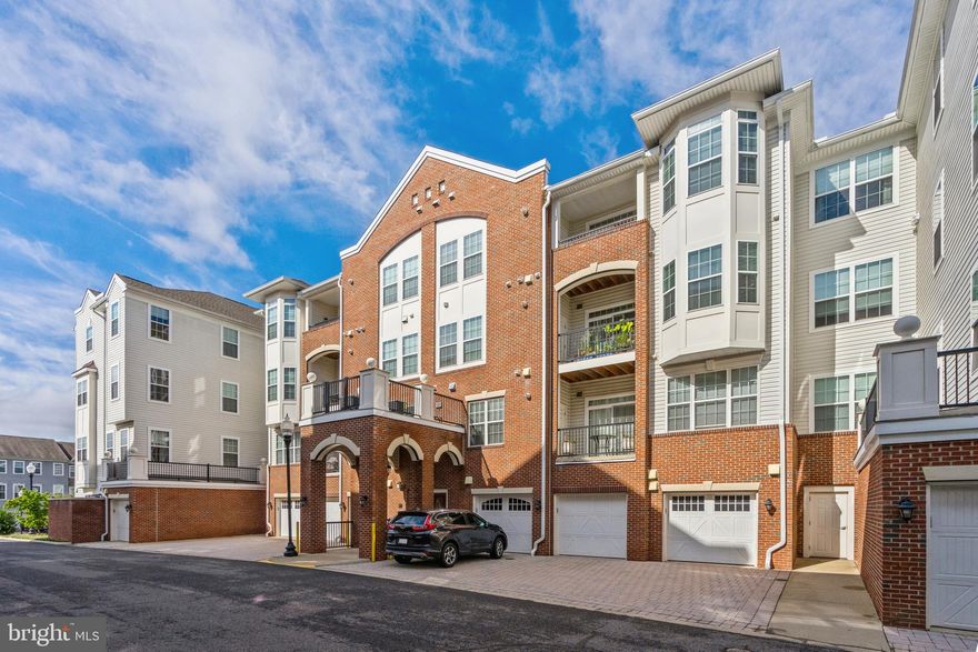 Immaculate 1,504 sqft 2 Bedroom, 2 Bath, Condo with Over-Sized One Car Garage at THE GATHERINGS - a Luxury 55+ Community.  The entry level unit has an open floor plan which is handicapped and wheelchair accessible.  Upon entering the unit, you are greeted with a kitchen boasting granite counters and stainless steel appliances with gas cooking.  Entering the dining/living room area with a tray ceiling gives you plenty of room to entertain family & friends for holidays or special occasions.  A cozy sitting room is perfect for sipping your coffee while reading your favorite book or simply relaxing.  The primary bedroom has a sitting area and walk-in closets.  The primary bath has a dual vanity with granite counters and walk-in shower with safety bars.  Second bedroom is large with a walk-in closet as well.  Second Bath has tub/shower with safety bars and granite counter.  Laundry Room has normal sized washer and dryer.  Unit comes with a one-car oversized garage.  Parking includes a space in front of your garage, in addition to reserved space #36 which conveys with the unit.  Ample street parking makes parking plentiful!  Condo Association Fee includes water, sewer, trash and snow removal.  Building Lobby is secured with a great sitting area and mailboxes.  Located in a great location - walk to shopping and dining.  VRE is located nearby.  If you are looking for the perfect senior living experience, this is it!  Condo won't last - come take a look.  You will be thankful you did!