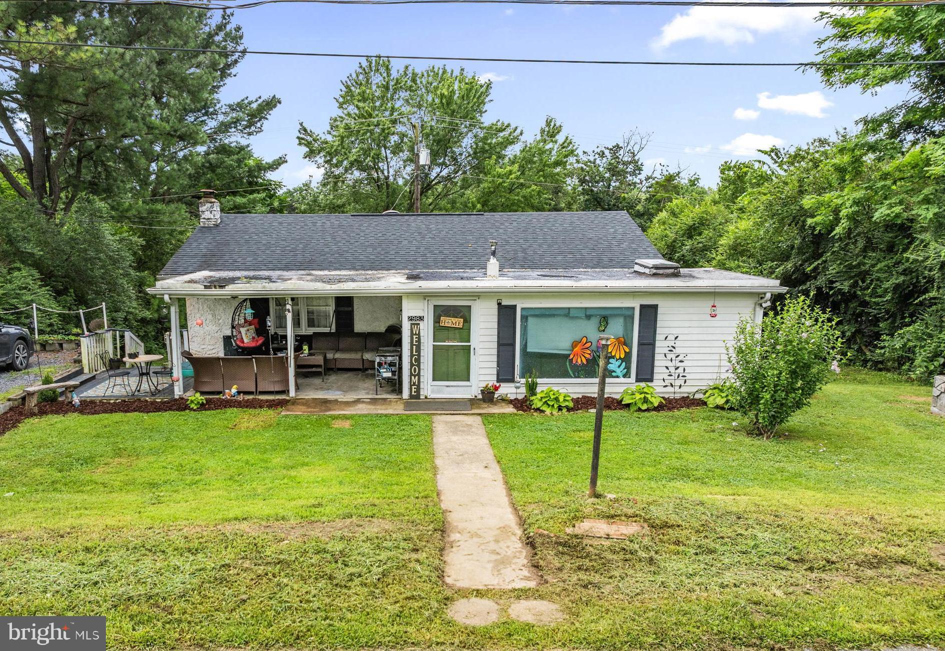Discover the potential in this charming rancher nestled on 1.22 acres across two combined lots in Edinburg, VA. With 3 bedrooms, 1 full bath, and a walkout basement, this home offers ample space and a flexible layout ready for your vision. Step inside to a generously sized living room that flows into a spacious kitchen with an island, perfect for everyday living or entertaining. A bright dining room with a corner built-in sits just off the kitchen, leading to the primary bedroom featuring a walk-in closet and direct access to the outside. Two additional bedrooms and a full bathroom are conveniently located down the hall.
The basement is a blank canvas—currently used as a play area and for storage, it also includes the laundry area and offers endless potential for additional living space. Enjoy your mornings on the covered front porch, or take advantage of the detached garage and the expansive backyard with room to roam. A deeded right of way leads to the back parcel, providing even more flexibility. With a newer HVAC system and great bones, this home is full of opportunity for those ready to make it their own.