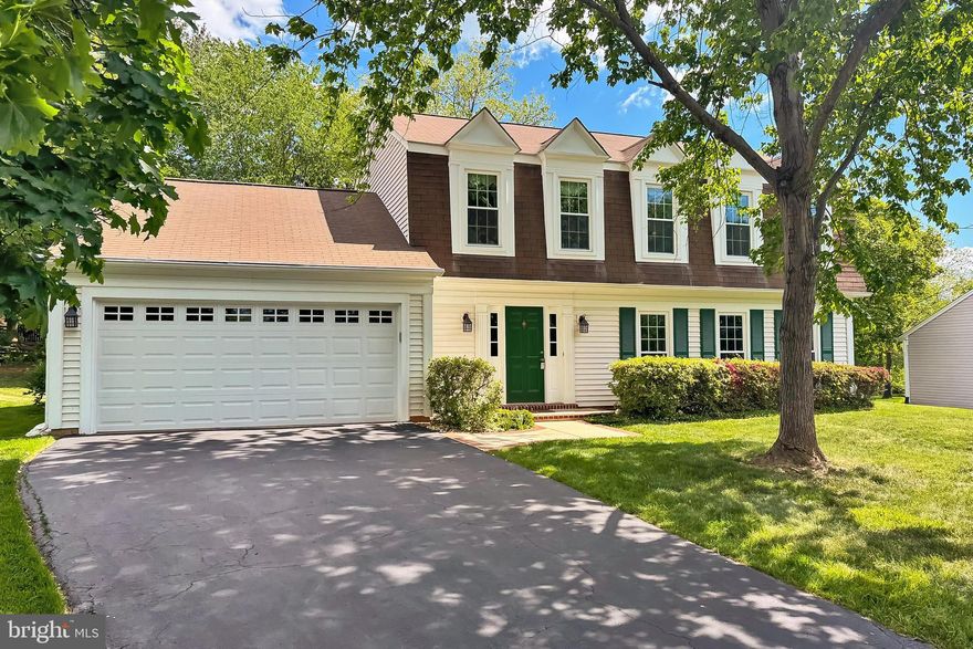 Welcome Home to 6 West Ct!  Tucked away on a quiet cul-de-sac in the sought-after Countryside neighborhood, this home has it ALL ** From its welcoming curb-appeal to the quiet backyard, this 4 bedroom, 2.5 Bath home has been lovingly cared for and updated ** Perfectly situated on a private lot with a wide driveway and expansive 2-car garage, the cheerful green front door greets you as you arrive home ** The welcoming foyer opens to a large Living Room with 3 huge windows overlooking the front yard, as well as an updated powder room [2025] ** Beautifully renovated kitchen [2020] includes custom cabinetry, granite counters and stainless steel appliances [2020 & 2022] ** The cozy Family Room features new carpeting [2025], a wood-burning fireplace with a custom mantel, and lots of gorgeous built-in bookshelves ** Elegant Dining Room features a chandelier and large bay window overlooking the side yard ** Main level laundry room includes built-in shelving, as well as a new washing machine [2025] and dryer, and conveniently leads to the huge garage with an alcove for extra storage/bikes/etc. ** The spacious Upper Level features brand new carpeting  and includes 4 Large Bedrooms with generous closet sizes -- including a large walk-in closet in the Primary Suite ** Both Upper Level Bathrooms have been recently updated [2025] **Other large upgrades include replacing the HVAC [2023], replacing the roof [2017] and replacing the windows [2022] ** Don't Miss This One!!