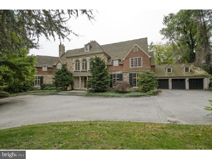 Combining the classic elegance of a traditional home with high ceilings and generous room sizes of more the currently desired floor plan, this home exudes modern day styling with exciting, open spaces and unfettered views of the home's park-like setting. A volume entrance Foyer with sweeping stair is highlighted by three gently arched windows and over-look balcony. To the left of Foyer find a step down formal Living Room with beautifully carved fireplace and beyond, through a wide cased archway, a handsome library/office.  The Library  offers walls of custom display shelving  and connects by private stair to the second level Master Bedroom suite as well as to the Gym and Sauna below.  Gracious Dining Room is highlighted by an elaborate domed ceiling and oversized windows adding both drama and an abundance of natural light to this formal setting. The Kitchen is the heart of the home with rustic honey-toned cabinetry, rich granite counters and professional quality appliances.  An adjacent Breakfast area and Family room is detailed with a coffered ceiling, wood burning fireplace and French door access to the upper rear stone terrace. Beyond a Solarium with wrap around windows, showcases the home's professional landscaping and connects the homes formal and informal spaces providing for a seamless flow for large or small scale entertaining.  Ascend the formal stair to the Master Bedroom suite enhanced by gleaming hardwood floors, a wood burning fireplace, Sitting Area, Morning Kitchen and deluxe Bath. Five additional family/guest bedrooms, each with en suite bath are found on this level.  The third floor features elevator access  to a  2nd room, one currently purposed as a guest room and full bath.  The elevator goes from the Basement to Attic.  Fully finished walk-out, Lower Level offers a large Gym, Recreation Room , full Bath ,Sauna and ample storage.  Mahoney built, Bissinger designed jewel of a home on one of Lower Merions most revered and desired streets complete with magnificent pool, hardscaping, Pool House with Kitchenette, wood burning fireplace his & her Cabanas and full bath.