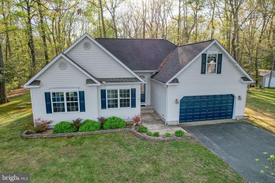 Please submit all offers by Sunday 4/19 @ 6pm. Nestled in the serene Woodfield neighborhood, this charming ranch-style home offers a perfect blend of comfort and modern living. Built in 2003, this well-maintained home boasts 1,600 sq. ft. of inviting space, featuring the owners suite with a full bath including a double sink and 2 more spacious bedrooms and a full bathroom. The home also has as a loft that could be utilized as a 4th bedroom, office area, gym or whatever your imagination can bring. The heart of the home is a cozy living area with vaulted ceilings and a wood-burning fireplace, perfect for gathering with loved ones on chilly evenings. The kitchen is a culinary delight, equipped with new flooring, slate countertops, stainless steel appliances, including a dishwasher and electric oven/range, ensuring meal prep is a breeze. Natural light floods the space, creating a at a warm and welcoming atmosphere. The main floor laundry adds convenience to your daily routine. Step outside to your expansive 0.53-acre lot, where you can enjoy the tranquility of nature. The backyard, partly wooded and backing to trees, offers a peaceful retreat, ideal for outdoor gatherings or quiet moments of reflection. A spacious deck invites you to savor morning coffee or evening sunsets surrounded by the beauty of your surroundings. With an attached two-car garage and ample driveway space, parking is never a concern. Located in a friendly community, you'll appreciate the nearby amenities, including parks, shopping, and dining options, all just a short drive away. This home is not just a place to live; it's a sanctuary where memories are made. Experience the perfect blend of comfort, nature, and community in this delightful property.