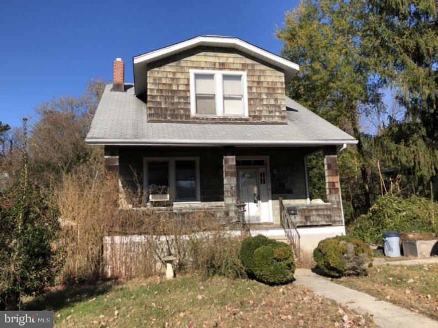 INVESTOR SPECIAL!   Classic Baltimore stained glass windows and hardwood floors.  Fantastic rehab potential with renovated homes in this area enjoying a great increase in value.   No FHA or VA.   Sold strictly 'AS IS'.