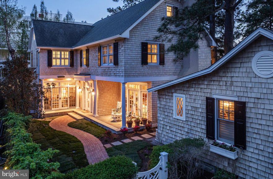 Welcome to the essence of casual coastal charm and versatility in the heart of “The Pines” neighborhood of downtown Rehoboth Beach! Nestled on a serene 50 x 100 parcel just one block north Rehoboth Avenue, this unique offering presents a blend of classic Nantucket style and modern functionality in two distinct cedar shingle style dwellings. Twice featured on the Rehoboth Art League house tour in 2008 and 2016, being sold fully furnished. The main attraction is an impressive three-story residence known as “Tucked Away,” featuring 4 spacious bedrooms and 3.5 bathrooms. From the inviting facade adorned with crisp white trim and charcoal black shutters to its roomy interior, every detail says welcome home. Step inside to discover a thoughtfully designed floor plan that seamlessly integrates comfortable living spaces with timeless architectural elements. Walnut and bluestone floors, coffered ceilings, custom built-ins, and classic moldings throughout create an atmosphere of warmth and sophistication. The heart of the home lies in its gourmet kitchen, complete with stainless appliances, custom cabinetry, honed granite counters, and a tiger maple island perfect for entertaining. Adjacent dining and multiple living areas offer effortless flow for hosting intimate dinners or lively gatherings. Level two is host to the bright and spacious primary suite with vaulted ceilings and exposed beams, a comfortable sitting area, ensuite tile bath, and custom closet. On this level, you will also find a laundry room, custom tiled hall bath with a jetted tub and separate shower, and 2 additional guest bedrooms. The 4th bedroom, loft entertainment area, and 3rd full bath can be found on the third level. The appeal of this property doesn’t end there. An additional 2 bedroom, 2 bath historic cottage, built circa 1930, is also nestled on this property. Renovated in 2005, this charming cottage offers additional accommodation options or income potential with its own separate entrance and amenities. Whether utilized as a guest suite, home office or rental opportunity, this versatile space adds value and flexibility to the property. This unique property offers easy access to Grove Park, the Rehoboth Farmers’ Market, vibrant dining, shopping, and entertainment scene, as well as its pristine beaches. With two rental licenses, the potential for investment income is excellent, making this a rare opportunity not to be missed!