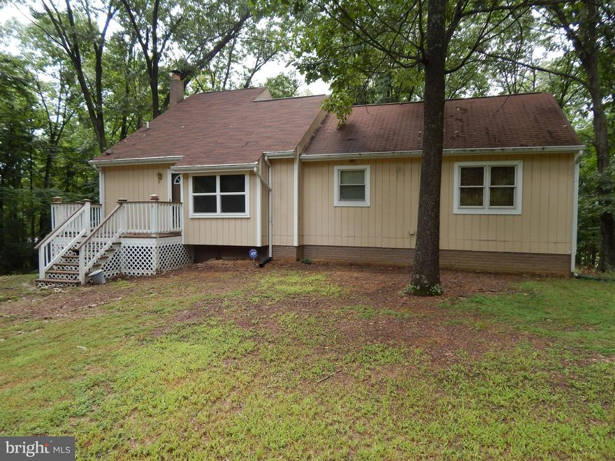 Charmer nestled on .98 Ac 15 Min from I-81 w/ winter mt. views. Main level features 1BR & 2BA, Kitchen/DR combo w/ pellet stove & spacious LR w/ wood floors.  Loft w/ BR space. Bsmt features 2 additional bedrooms + 1 full bath & family room w/ wood stove & laundry area. 2 BR septic system. Built in 1985/remodeled in 2006. 2 levels of decks, one covered for outdoor entertaining. Shed for storage