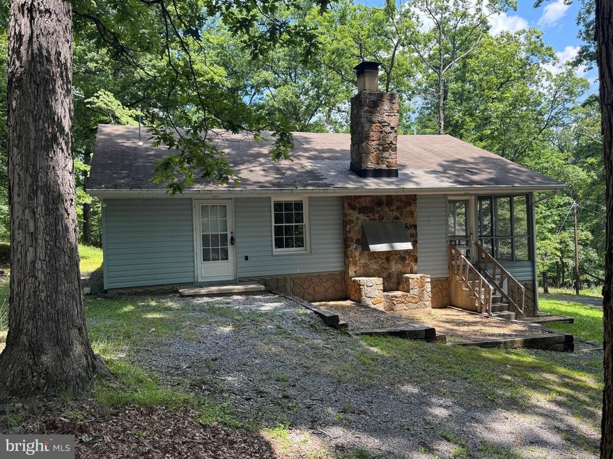 Great opportunity on this ranch style home located in  Sleepy Hollow subdivision !  The home features 2 bedrooms, 1 full bath, large screened in porch, and  beautiful Stone Hearth Fireplace.  Sitting  on an1.42 acre wooded lot! Sleepy Hollow Subdivision offers access to a small lake with beach.  Don't miss out on this one!!