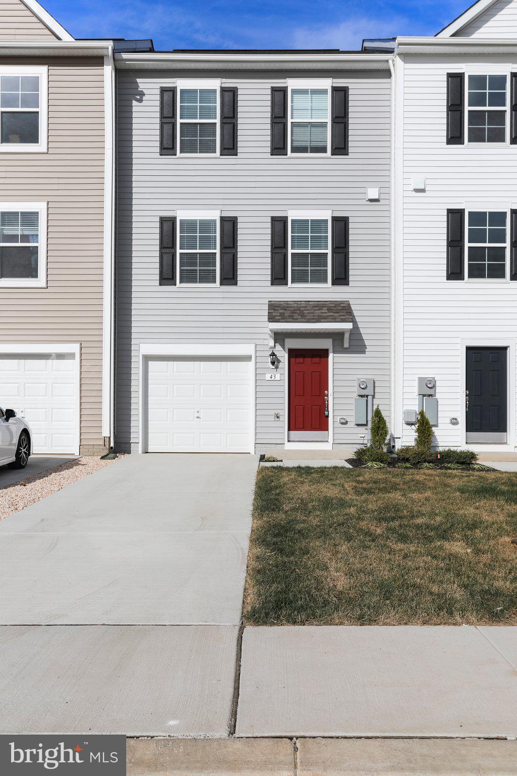 $3,000 closing cost credit to buyer is offered by seller for a full price offer!
A beautifully maintained three-level garage townhome offering comfort, functionality, and modern style in a prime commuter location just minutes from Martinsburg, the Virginia state line, and I-81.
The entry level features a one-car garage, a welcoming foyer with a coat closet, and a spacious unfinished storage area with potential for future customization and maintenance-free water softener.
Upstairs, the open-concept main level is perfect for everyday living and entertaining, with a spacious living room, dining area, and a well-appointed kitchen complete with granite countertops and a versatile microwave/air fryer combo.
The top floor offers a relaxing primary suite with vaulted ceilings, a large walk-in closet, and an upgraded ensuite bath featuring a double vanity. Two additional bedrooms, a full hall bath, and a convenient laundry area complete this level.
Additional features include LVP flooring throughout the home (except stairways),wood blinds throughout, ceiling fans in all bedrooms and the living room, and a garage door opener with remotes.
Don't miss your opportunity to own this charming home—just 10 minutes to downtown Martinsburg and close to I-81 for easy commuting. Schedule your showing today!