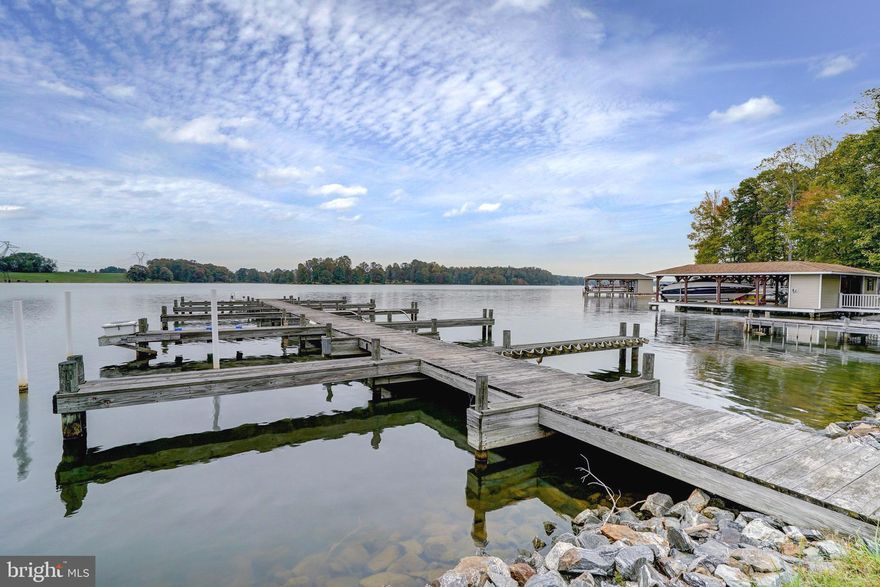 Beautiful water access lot with assigned boat slip, just a short golf cart ride to the waterfront common area on the private side of Lake Anna, Virginia.   This lot is at the end of a quiet cul-de-sac with a home site already cleared, and the driveway is already in place, which makes it much easier for you to build your dream home (or your short-term rental property) here in the sought-after Cuckoo's Nest subdivision; nice level lot, perfect for building your lake house.  This neighborhood is one of the few neighborhoods at the lake that offer multiple common areas. Enjoy your very own deep water boat slip #14 (common area #2, pier 6, slip #14 at the end of Elnor Rd) - never worry about having a spot to park or store your boat.   This subdivision offers many amenities, including a big sandy beach, playground, covered picnic area, a boat ramp, docks, and more!  Cuckoo's Nest is one of the only subdivisions on Lake Anna with two common areas offering many amenities (and thereby increasing your property value).  Only a short drive to groceries, restaurants, The Lake Anna Taphouse, the Lake Anna Regional Airport, ABC, Lake Anna Veterinary Clinic, and more!