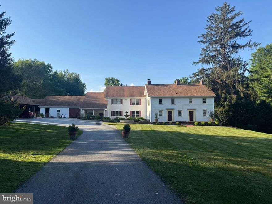 This beautiful, gated estate is a classic example of an historic Chester County farmhouse, with 2 much newer additions, nestled on 2.35  of beautifully maintained grounds—next to 8 acres of open space. Plus check out the adjacent building lot also available for an additional $350, 000 . Immediately upon entry through the electronic artisan-built Sapele wood gates feels like stepping back into time. The lawns, fountains and plantings (e.g., rose garden and pollinating garden) set the tone of a Longwood Gardens-inspired atmosphere and three-section home. The 1746 and 1850’s stone sections of the home have been lovingly brought up to today's standard without losing their historic charm. For example, these sections include new wood fireplace mantels and paneling (milled by Tim Flegal from HGTV) and marble windowsills. The recently added section circa 2009 boasts a great room with 9ft ceilings, a chef’s kitchen with stone counter tops, and integrated appliances (2 cabinet front dishwashers, Cabinet front refrigerator, double ovens, an in counter deep fryer and a 6-burner gas Wolf cook top). The spacious pantry has a subzero fridge. Additionally, this section has exposed wood beams, exposed stone walls, huge picture glass windows with views of a back yard reminiscent of Longwood gardens. Each section of the home is integrated into the next, with a unique flow throughout the house on the first floor and the 2nd floor. By the way, the world-renowned Longwood Gardens is a mere 5 minutes away.  And watch Longwood Fireworks from your yard at he top of the property,  And dark night sky often clear enough to the meteor showers. There are also ponds and wetlands visible from the grounds, notably in the fall, winter, and spring.