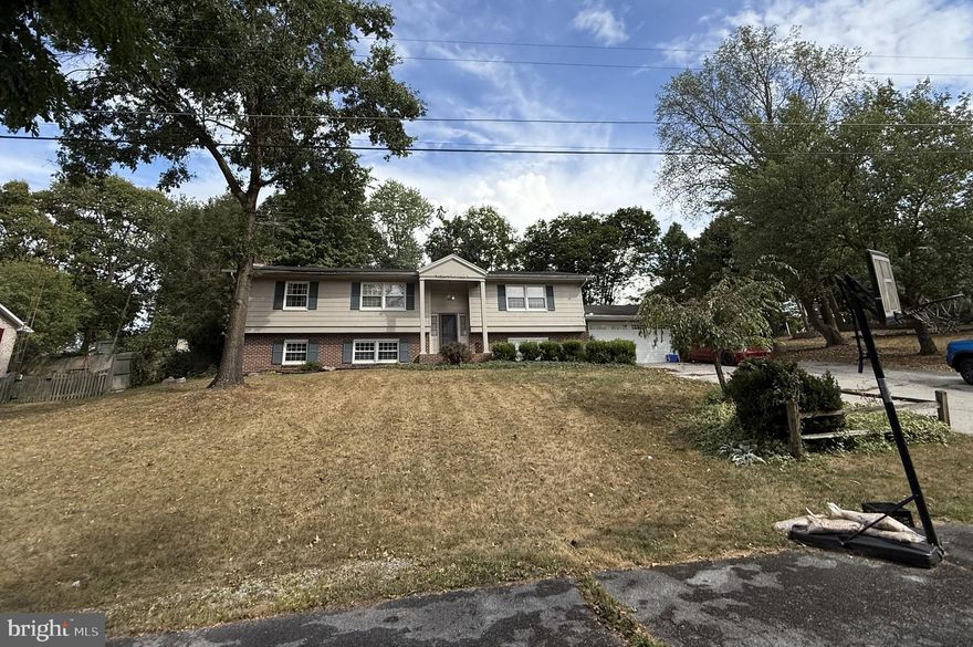 Welcome to this spacious split-level home in Martinsburg, offering a generous 2,903 square feet of living space. The home sits on a 0.45-acre lot and features a welcoming interior with a mix of laminate, wood, and carpet flooring. The kitchen is appointed with granite countertops. A fireplace adds a cozy touch to the living area, and the finished basement provides additional flexible space .The roof was replaced in 2013. With a solid structure and a split-level foyer, this home awaits your personal touch to make it shine.