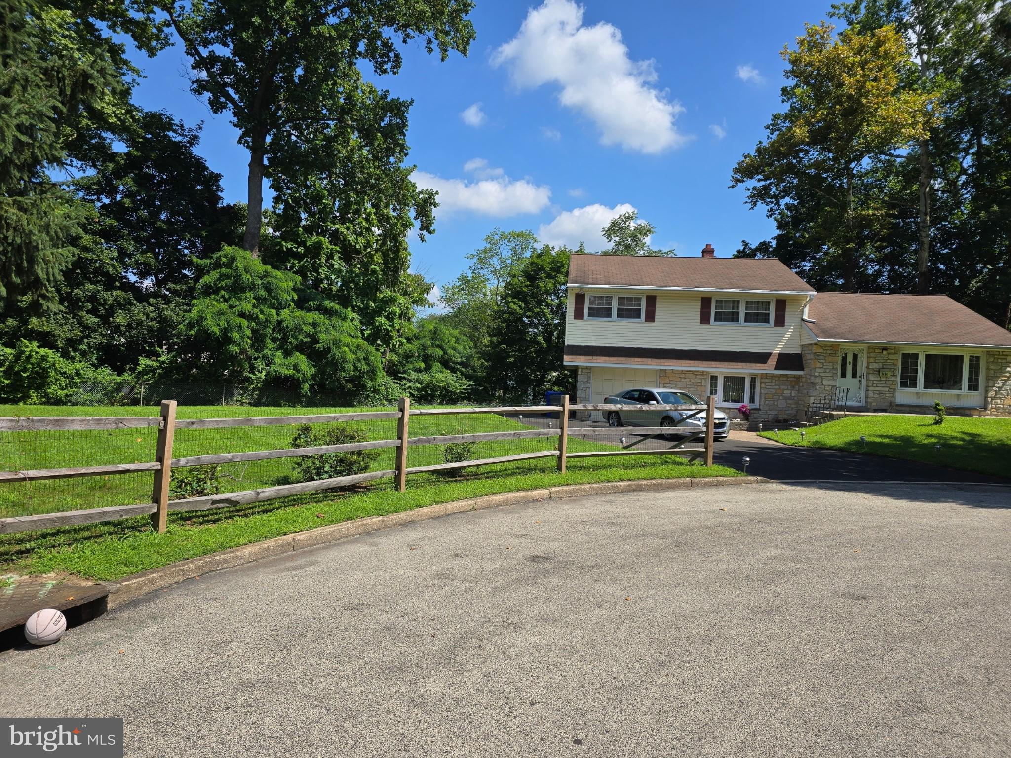 Welcome to 7414 Richards Rd, perfectly situated in the middle of a sought-after and peaceful cul-de-sac in Elkins Park. The open layout style paired with oversized windows boasters natural light, with tranquil views of surrounding trees and plant life. This space creates a warm and inviting atmosphere throughout the main living area. On the upper level of this single split-level home, features 3 generously sized bedrooms, spacious walk-in closets and 2 1/2 baths. With master bedroom has its own en-suite bath. The kitchen and dining area exit to your stone patio, which is wonderful for entertaining guests, relaxing with family, or grilling with friends. The finished basement serves as a cozy family room adding even more versatility to this lovely home with a washer/dryer area and walkout entry to the extra-large, beautiful yard. This home is ready for its new owner - we can't wait to have you come by!