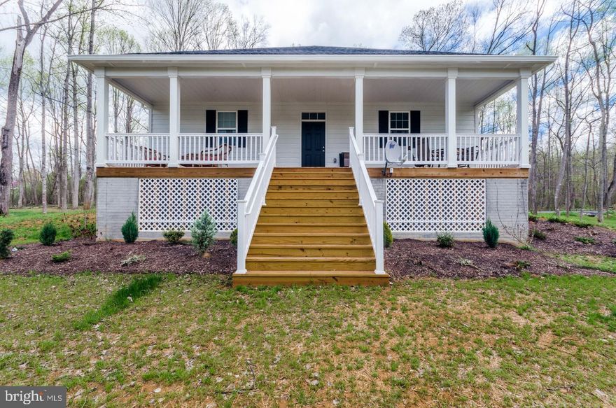 Spacious and Beautiful, this Contemporary home is located in Chimney Hills Estates on over 2 acres.  The private lane is access to just three other homes and feels like you are living far away from busy life, but is only 20 minutes from Winchester!  Hardwood  and Tile Floors, custom trim and 9' Ceilings throughout the main level.  The Gourmet Kitchen overlooks the Dining & Living Rooms and has a Large Central Island with Seating.  Counters are granite and all of the cabinetry has soft close mechanisms installed.  The Master Suite has an expansive bathroom with double vanity, tiled walk-in vanity and a deep soaking tub. The laundry room is on the main level  just off the garage entrance.  This is truly one-level living at its finest!  If more space is what you need, don't worry because the basement has a Over-Sized Family Room with room for games plus an area that could become an office or exercise room.  Both finished rooms lead outside to the covered patio that can be screened in for bug free enjoyment during the warmer months.  If a 4th sleeping area is needed, there is unfinished space that would be great as a 4th bedroom that leads to its own bath AND still have room for a large storage room! The covered front porch looks out onto the wooded yard and is a place to enjoy the sights and sounds of Mother Nature.  Owner has installed a water softener plus there is a radon mitigation system and 2 hot water heaters.  Gas logs in the living room have not been hooked up.