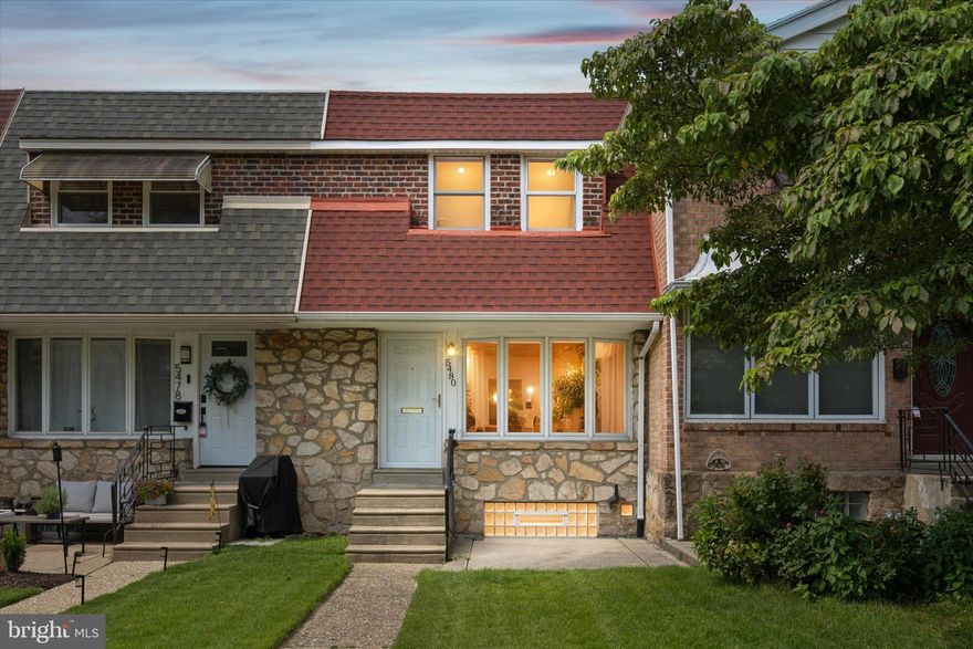 Welcome to this beautifully maintained 3-bedroom, 1-bath brick home offering comfort, functionality, and unbeatable convenience. Nestled in a sought-after neighborhood, this home features a lovely front patio and yard—perfect for relaxing or entertaining.  Step inside to a spacious living room with a coat closet and a newer bay window with a deep sill, bringing in an abundance of natural light. The adjoining dining room flows seamlessly into the updated kitchen, complete with light oak wood cabinetry, stainless steel appliances, brushed nickel hardware, a 5-burner gas stove with grill burner, recessed lighting, built-in microwave, garbage disposal, and dishwasher. The generously sized 16x10 primary bedroom boasts excellent closet space, while the two additional bedrooms also offer roomy closets. The updated hall bath features beautiful tile work, a tub/shower combo, recessed lighting, and a decorative tile backsplash with a stylish vanity and storage.  The finished lower level provides extra living space, perfect for a family room, craft room or home office. This room comes complete with a large block window for natural light. This level also includes a laundry area and access to the 1-car attached garage with automatic opener and storage shelves.  A private driveway provides an additional parking spot. Additional Features include a Brand-new hot water heater, Newer HVAC system, Updated 100-amp circuit breaker electric, Central air, Hardwood floors under carpets and newer doors throughout.  This Fantastic Location is just a short walk to Daisy Field, Walnut Lane Golf Course, Dalessandro's Steaks, Wissahickon Train Station, public transit, and the beloved C&C Creamery. Also nearby are Wissahickon trails, many colleges, parks and so much more. Don't miss the opportunity to own this charming, move-in-ready home in a vibrant and walkable community!