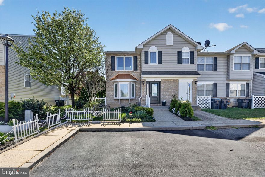 Step into the timeless charm of 32 Salerno Dr., an end-unit townhome that perfectly combines comfort, style, and convenience, nestled in Smyrna, Delaware. Built with precision by Lenape Builders in Cambria Village, this Brandywine Model—the largest in the development at 1,512 sqft—boasts a classic brick and vinyl exterior. Highlighted by a unique bay window with new Renewal by Andersen windows that bathe the interior with natural light, inside you will find a meticulously maintained 3-bedroom, 2.5-bath private haven brimming with thoughtful updates.

The warm laminate wood floors stretch through the living and dining combo, creating a seamless flow into the kitchen, where cherry cabinets, white appliances, a stainless steel sink, and disposal await. Step through the sliding glass doors to a recently refurbished screened porch, complete with a ceiling fan, light, gutters and downspouts, and even a cable hookup, overlooking a serene open space with a tot lot to the left and a tranquil pond to the right. The backyard is fenced with a refurbished shed.

This home’s updates are extensive and impressive. To name a few: new Renewal by Andersen front windows and front door, which come with a transferable lifetime warranty; new energy-efficient heating and air units, also under warranty; a refurbished half bath on the main level that shines with luxury; a new refrigerator and recent kitchen appliances. The expansive master suite includes a recently refurbished full bath and is impressive. The second and third bedrooms are connected by a Jack and Jill full bath.

The ready-to-be-finished full basement has heat and air ducts already installed, as well as a recent laundry sink next to the washer and dryer and a sump pump with a new motor. The mature and tastefully landscaped exterior includes solar lights around the front, side, and rear. All appliances will be staying in this extremely energy-efficient home with an unbeatable location—just 3 minutes to Routes 1 & 13, close to schools, shopping, dining, and even Delaware’s beautiful beaches.