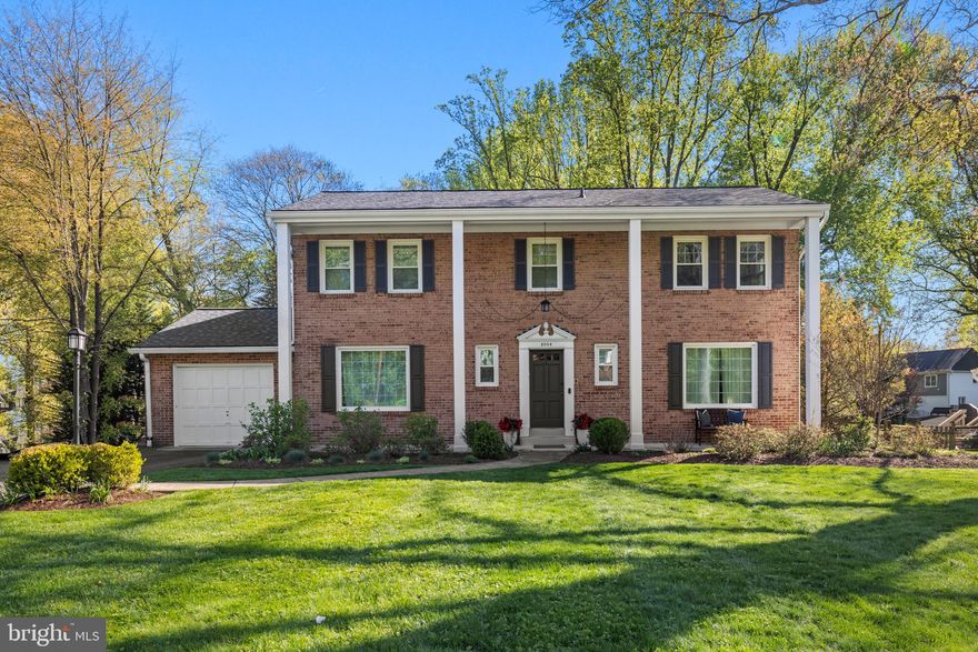 Welcome to 8004 Cindy Lane, a beautifully maintained and updated brick Colonial tucked away on a quiet street in Bethesda.  Located in Winston Churchill High School District, this classic home offers the perfect blend of traditional charm and thoughtful updates, with spacious interiors, abundant natural light, and a backyard retreat that invites outdoor living.
The main level features a gracious entry hall, a bright extra large living room with a picture window, and a comfortable family room with French doors that open to a beautiful patio and large, fenced backyard. The kitchen has been tastefully updated with granite countertops, white cabinetry, stainless steel appliances, and a sunny garden window that looks out onto blooming camellias. A formal dining room and stylishly renovated powder room complete the main level.
Upstairs, the spacious primary suite includes a refreshed en-suite bath and ample closet space. Three additional bedrooms share an updated hall bath, and a versatile bonus area off the primary bedroom offers flexibility for extra closet space, a home office, dressing room, or nursery. Hardwood floors run throughout both the main and upper levels, and the finished lower level includes a rec room, laundry area, additional storage, and newer carpet as well plenty of space to add another bathroom and bedroom.
Set on a beautifully landscaped lot with a wide driveway, mature trees, and privacy fencing, this home also benefits from key system updates including an upgraded electrical panel and improved driveway.