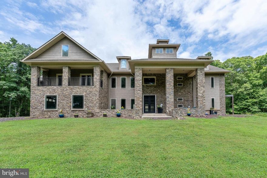 *24 Hour Notice for all showings is preferred* *ATTENTION INVESTORS, DEVELOPER, VISIONARIES** FINISH THIS DREAM ICF HOME ON 28 PRIVATE ACRES, ONLY 15 MINUTES AWAY FROM LAKE ANNA!!  4 TOTAL Parcels being sold TOGETHER as a bundle.  ONE large parcel (28-acres with 2 homes), and an additional THREE 3-acre parcels (9-acres), so a total of 4 parcels that total 37 acres, oh, did I mention it has its own private lake.  The main (large) home is over 10,000 square feet of meticulously cut artisan stone with up to 6 bedrooms, a massive 2-story great room, 2-story owner’s suite closet, and an INDOOR Pool.  The entire home is constructed with ICF (Insulated Concrete Forms).  ICF are EPS foam blocks with rebar-reinforced cores that are filled with poured concrete. This construction system is categorically the most energy efficient and most structurally sound wall system on the market. It can withstand hurricanes, earthquakes, you name it. ICF provides incredible insulation, making the home very comfortable, free of mold, mildew, bugs and maintains a temperature between 68-72 degrees inside the home.  You can complete the construction of your very own ICF home at a fraction of the cost. Framing has been completed, plumbing and electrical rough-ins are installed but allows flexibility for non-structural design changes. This is an extremely unique opportunity that can serve so many purposes, the possibilities are truly endless with an incredible home, a beautiful wooded lot and its own private lake. For those car Enthusiasts, this home boasts a 3-car attached garage and a detached 3-car carport on the 2nd home in the back. The current floor plan includes an elevator from the basement all the way to the 4th floor cupola. The massive 9ft wrought iron double entrance doors lead to a massive and open 2-story foyer, 2-story great room and 20ft tall fireplace. The enormous chef's kitchen could include a beautiful oversized island.  Off of the kitchen is a huge dining room and sitting room, making this home perfect for entertaining.  The main level also includes two ensuites with private entrances. Second level opens to a catwalk overlooking the great room and separating the owner's wing from the first level of the 2-story library including a balcony, kitchenette, second fireplace, and half bath, A expansive 44x24 owners suite offers two separate full baths, one with an oversized walk-in shower and the 2nd with a walkthrough shower, Sanijet tub and two-sided fireplace overlooking the indoor pool, an enormous 2-story 24x20ft closet as well as an owner’s morning kitchen. The 3rd level offers maximum privacy and serenity, perfect for an owner's office, the 2nd level of the 2-story library and two other nicely sized bedrooms and full bath.  Also included is a 2,600 sq ft, 3-bedroom, 2.5 bath guest house in the back of the lot equipped with upper and lower-level kitchens, with stainless appliances, 8ft center island with quartzite countertops and waterfall edges, family room, office space, beautiful casement windows. This Space can easily convert back to an impressive garage with 11ft ceilings for the car enthusiast, storing RV/boats and toys of all sizes or remain gorgeous living quarters for an in-law palace or apartment. Bring your vision and turn this into the home of your dreams with room for horses, or hosting events, an Airbnb vacation or events home, a vineyard, develop a small community of homes.... the possibilities are truly endless. This home is conveniently located between Richmond, DC/NOVA and Charlottesville. Schedule your private tour and you make this one-of-a-kind home yours. **Third-party sites tax assessment may be inaccurate. Correct Assessment for all parcels is approximately $800,000.