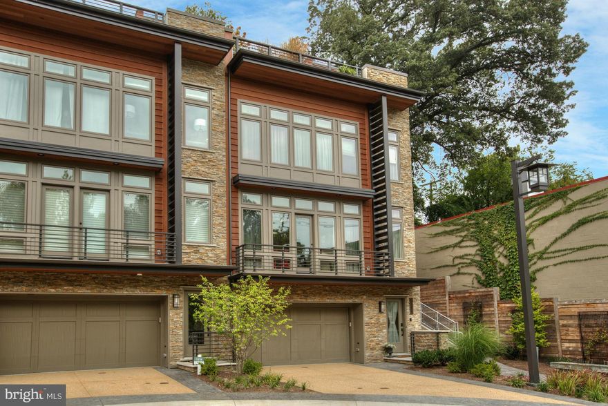 NEWLY PRICED EXCEPTIONAL OFFERING! Sophisticated &Turnkey 3BR/2FB/2HB semi-detach TH just 2 stoplights to DC. Beautifully customized throughout, Elevator, Rooftop w treetop views Firepl & outdoor Kitch, 2-car Garage, stunning Kitch w island & luxurious Owners Suite w WIC, ensuite BA, finished LL offers versatile space. Lush setting convenient to Cap Cres Trail. LEED Certified OPEN SUN 1/15 2-4pm!