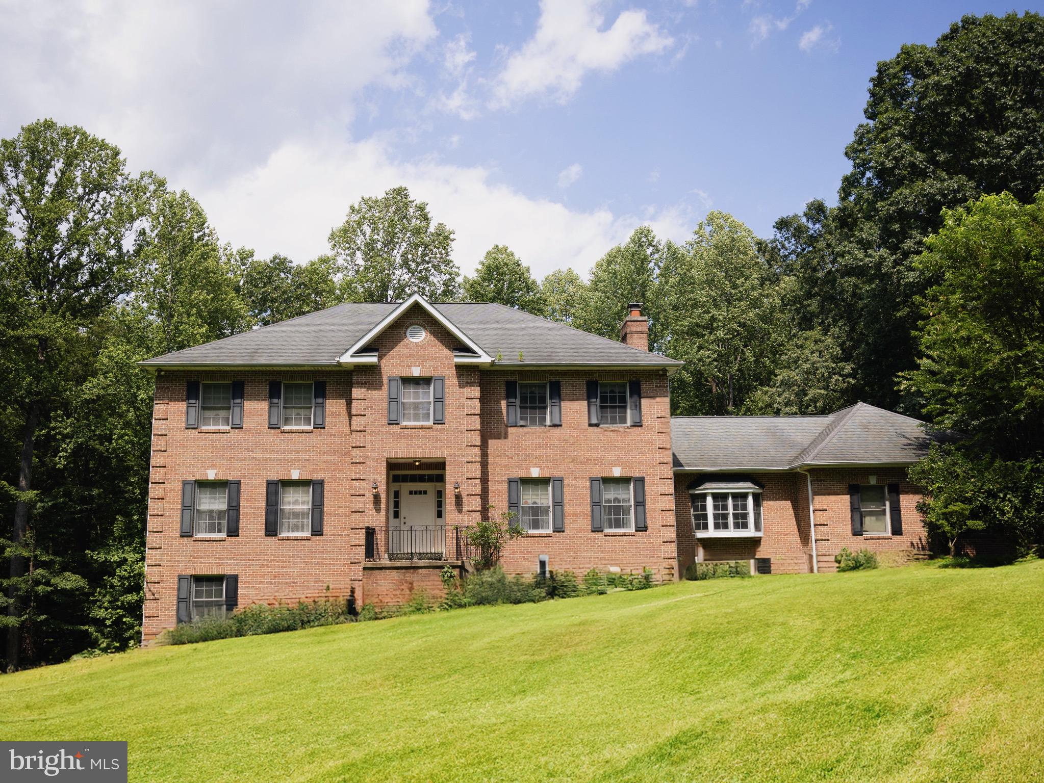 Welcome to 13814 West End Farm Road — a beautiful all-brick home nestled on over 5 acres in a serene community. This spacious 4-bedroom, 4-bathroom residence offers the perfect blend of functionality, charm, and opportunity.
A long, tree-lined private driveway leads you to a home where comfort meets sustainability. Inside, you’ll find a wood-burning fireplace for cozy evenings, and a solar farm that nearly eliminates your energy bills.
The expansive primary suite features plenty of natural light and a private office or sitting area, ideal for working from home or relaxing. The unfinished basement offers a blank canvas to create your dream space whether that’s a home gym, guest suite, or entertainment area.
If you're looking for space, privacy, and efficiency in a peaceful setting, this is the one you've been waiting for. Schedule your private tour today!