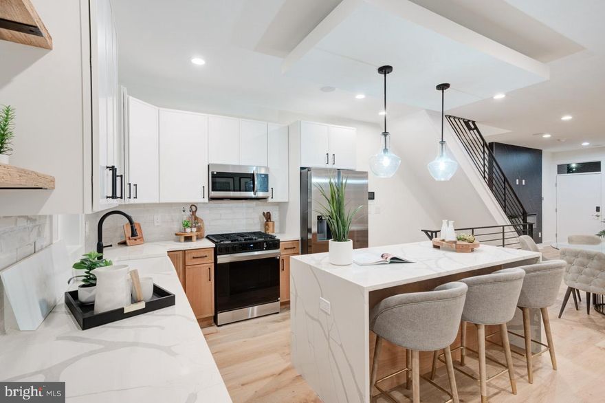 Welcome to 2622 E Harold Street — a stunning, fully completed brand-new construction residence part of a  4 home new construction project  offering 4 bedrooms, 3 bathrooms, and approximately 2,300 square feet of beautifully created living space just minutes from the heart of Fishtown. !!   Step inside to an open-concept main level where high ceilings, engineered hardwood floors, and refined finishes set the tone. The designer chef’s kitchen is the centerpiece of the floor, featuring a centered island, sleek modern cabinetry, and a premium appliance package. Large sliding glass doors open to a private rear patio—perfect for grilling, relaxing, or enjoying time outdoors.  The second floor hosts two generous bedrooms and a chic, contemporary full bathroom. Continue up to the third floor, entirely dedicated to a luxurious primary suite. Here, you'll find abundant closet space and a tastefully designed bathroom created for comfort and relaxation. A convenient wet bar on this level leads to the expansive rooftop deck, where panoramic skyline views offer an incredible setting for entertaining.  The fully finished basement provides outstanding flexibility—ideal as a secondary living room, home office, fitness area, or guest quarters. This level also includes the fourth bedroom and an additional full bathroom, making it a great private suite option.  Additional features include dual-zone HVAC, integrated surveillance and security upgrades, and the valuable New Construction Tax Abatement to help lower monthly carrying costs combined with a 1 year builders warranty for added comfort and assurance. Nestled steps from Aramingo Square Park and within walking distance to Fishtown’s vibrant dining scene, cafés, gyms, and grocery stores, this home delivers the perfect blend of high-end new construction and everyday convenience.  Schedule your private tour today.