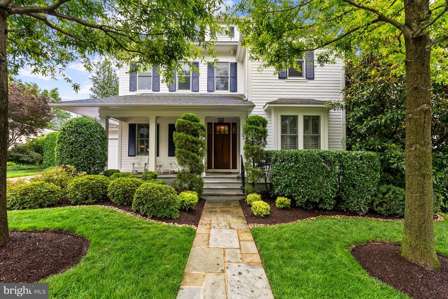 Gracefully sited on a beautifully landscaped lot in the sought-after Dover Balmoral Riverwood neighborhood, 2407 N. Nelson Street is a 5-bedroom, 4.5-bath modern residence that pairs timeless elegance and sophistication into thoughtfully designed living spaces. A flagstone walkway leads to a welcoming front porch and upon entry, the main level unfolds with style and functionality. On the left side of the foyer, a perfectly appointed home office and a powder room lead to a spacious mudroom with access to both a two-car garage and the driveway. On the right side, a sunlit living room flows into a formal dining room, a butler’s pantry, and finally an expansive eat-in kitchen. Anchored by a marble island and complemented by custom cabinetry and marble backsplash, the kitchen opens seamlessly to a warm and airy family room with a fireplace and walk-out access to the serene backyard and flagstone patio. 
Upstairs, refined details like classic wainscoting and a built-in window seat add character and warmth to the living spaces. The luxurious primary suite serves as a tranquil retreat, featuring a spa-inspired marble bath with a standing shower and freestanding clawfoot tub. Alongside a spacious second en-suite bedroom, this level also holds a 3rd and 4th bedroom, connected by a shared bath.  A generous laundry room with a sink, open shelving, and ample storage complete this well-appointed upper level.  The finished lower level offers exceptional versatility, featuring a spacious recreation room, a full bedroom and bathroom, and two flexible rooms ideal for a home gym, office, or creative studio. 
Outside, the home is enveloped by mature landscaping and lush gardens, creating a serene setting for outdoor living and entertaining. This exceptional residence is one red light away from Downtown DC and enjoys easy access to GW Parkway, Francis Scott Key Bridge, Reagan National Airport, Route 66, Clarendon, Ballston, Potomac Overlook Park, and the Curtis Trail.  
*The home is available furnished for the ultimate convenience of its next owner.* (*Note: While most of the furniture pictured is available to be conveyed, a portion has been staged and would not be available.)