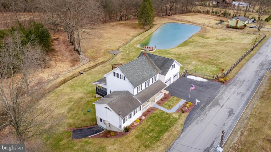 Discover the perfect blend of comfort and natural beauty with this wonderfully updated 3-bedroom 2 full bathroom home set on a picturesque 2.47 acre lot featuring a pond and stream.  Step inside to find a thoughtfully updated interior offering a warm and inviting layout.  Spacious main floor offers updated kitchen that opens to patio doors leading to a covered rear deck creating a perfect indoor-outdoor flow while overlooking the peaceful pond and scenic surroundings.  Large great room showcases vaulted ceilings offering an airy and open feel while a separate dining area provides a dedicated space for family meals.  Convenience continues with a main floor full bathroom along with a separate mudroom and laundry area.  Second floor offers 3 bedrooms and updated full bathroom with a walk-in shower completing the second floor.  Outdoors is spectacular featuring a covered front porch, covered rear deck, meticulous landscaping, large pond with deck and flowing stream.  Additional outdoor storage area is in the lower level of the home.  Amazing 2 car attached garage offers parking for 2 cars and second floor finished space provides excellent flexibility and possibilities for a home office, studio, hobby space or guest area.  There is too much to mention how wonderful this home is- come see for yourself and call for your private showing today!