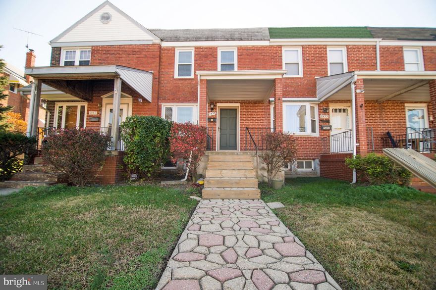 Here's your end of the year deal!  This brick rowhome features hardwood floors under the carpet, an open kitchen to the dining room and a spacious living room.  There is a generously sized master bedroom and the basement includes a family room, a second full bathroom and walk-out steps to the backyard.  On top of all that you have a covered front porch, off street parking and central A/C.  Move-in ready and located in a great location near stores, restaurants and easy access to 695.