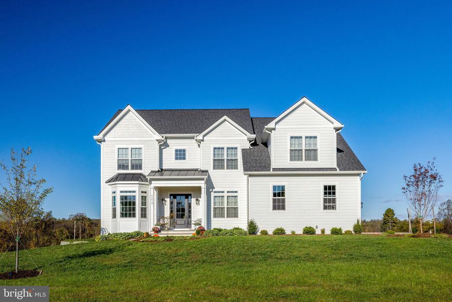 Only two years young, this exceptional home is sited on a stunning, level two-acre lot in a bucolic, established neighborhood. Offering five bedrooms and four full baths, including three baths on the upper level and a flexible main-level bedroom option, this home is designed to meet today’s lifestyle needs. The light-filled open-concept floor plan features 10-foot ceilings, an oversized kitchen island with premium cabinetry and appliances, modern wainscoting, and triple crown molding throughout. A welcoming covered front porch and low-maintenance Hardiplank siding enhance the exterior. Out back, a spacious deck overlooks the fully fenced, expansive, flat, and private backyard. Enjoy the perfect blend of country living with everyday convenience.