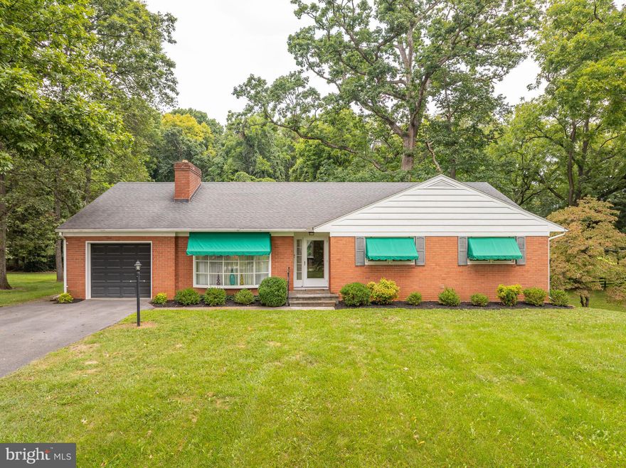 Welcome to this picturesque property located in rural Charles Town, WV.   This attractive four (4) bedroom brick raised ranch style home is situated on a well landscaped one (1) acre
lot with mature oak trees.  Eat in kitchen with views of the woods to watch the deer graze, living room with a wood burning fireplace and large bow window overlooking the Blue Ridge Mountains, dining room, three (3) bedrooms on main floor with cedar lined walk in closets in master, laundry room and full bathroom. The partially finished basement has a large recreation room, bedroom, Jack & Jill bathroom, unfinished section can be used for storage or a workshop.  Amenities include hardwood floors throughout (carpet over hardwood in bedrooms), one car attached garage, side porch, large brick/concrete patio on back, double hung windows, window awnings, and close proximity to downtown Charles Town and the Summit Point Raceway. This house is a must see!  Location! Location!