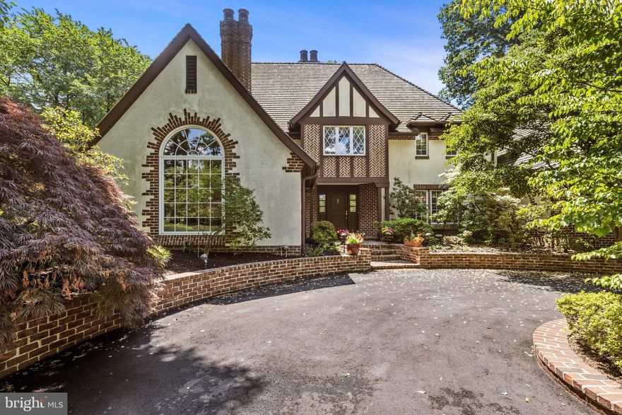 Welcome to the “One of a Kind” Custom Tudor Home in Prestigious Villanova.  This wonderful home is situated on a picturesque 1.33 acre lot offering an abundance of privacy and exquisite landscaping.  The exterior of this elegant home features a circular driveway and beautiful architectural details.  This “One of a Kind” home has a rear patio with awning that is very inviting and creates a sense of Tranquility. This property has been meticulously maintained inside and outside. 705 Cedar Lane offers 4 bedrooms and 3 ½ baths. Exquisite craftsmanship throughout with detailed moldings and millwork.  2 Fireplaces, Beautiful pegged hardwood Floors and also a much sought after bedroom suite on the main level.  The Bedroom Suite on the Main Level features a large Bathroom and generous closet Spaces. On the Second Level you will find a Large Main Bedroom suite with abundant closet spaces and lovely Au-suite bathroom.  Two other bedrooms on this level with a Jack and Jill Bathroom. Highlights include: a large great room with Fireplace (gas insert) Cathedral Ceiling with Trusses and Built-in wet bar.  A Gourmet Kitchen  that would delight any chef with it’s Custom Cabinetry, Granite Countertops, Sub-zero refrigerator and separate full size Sub-zero Freezer; Bosch 5 burner gas range, along with 2 Bosh wall ovens and Bosh dishwasher, Microwave and Wine Cooler. The kitchen also features a Center Island and a generous Breakfast room area with French Doors that lead out to the inviting patio which is perfect for dining “Al Fresco”. The Living Room features 15 ft. ceilings, large Palladium window and wood burning fireplace. Large Formal Dining Room perfect for Holiday Festivities. Powder Room on this Main Level.  The flow to the Floor Plan and The magnificent outdoor spaces make this home a perfect place for entertaining .  The lower level is finished and perfect for an At Home Gym or Recreation Room.  Large full Attic with easy access staircase and over-sized cedar closet for storage.  3 zone Heating system (3 electric heat pumps, 2 of which have gas back-ups, 1 with electric back-up). Laundry Room on Main Level with LG washer and dryer. For an added bonus, there are 2 Electric Vehicle charging stations in the garage! This convenient location is within minutes of Villanova train station, King of Prussia Mall, Bryn Mawr and Suburban Square in Ardmore.  Close to all major highways and located in the Award Winning Lower Merion School District.