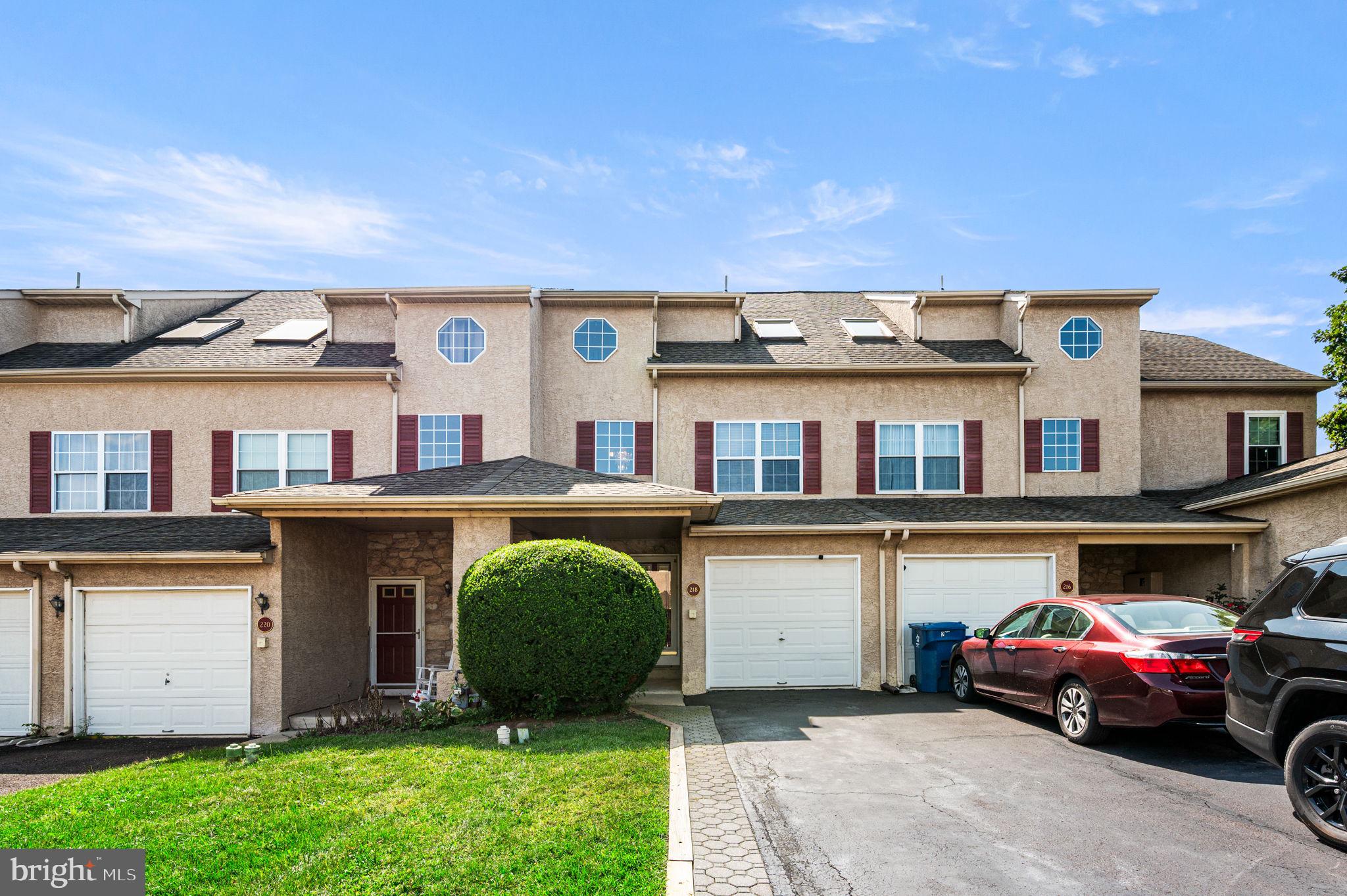 Welcome to the perfect townhome in the highly sought-after Souderton School District! This spacious 3-bedroom, 2.5-bath home offers a wonderful blend of comfort, convenience, and versatile living space. Step into the impressive two-story foyer, where hardwood laminate flooring flows throughout the main level. The open-concept design connects the kitchen, dining, and living areas making it perfect for both everyday living and entertaining. From the living room, step onto the expansive deck, an ideal spot to relax and enjoy the outdoors. Upstairs, brand-new plush carpeting enhances the bedrooms on both the second and third levels. The second floor features two generously sized bedrooms with excellent closet space, including one with private access to the hall bath. The third floor is a true retreat, showcasing an oversized private suite with soaring ceilings, abundant natural light, and an ensuite bathroom complete with a soaking tub and skylight.The finished basement provides flexible space that can serve as a recreation room, home office, or cozy den. The one-car garage has been thoughtfully reimagined—divided into two sections to maximize function. One half has been converted into additional interior space, perfect as a game room, home gym, or extra storage. The other portion remains ideal for storing lawn tools, bikes, or trash bins. Plus, the private driveway still provides off-street parking. Located just minutes from Routes 309, 476, and 202, commuting is simple, while shopping, dining, and entertainment are all nearby.Don’t miss the opportunity to own this beautifully updated townhome in the Souderton School District. Schedule your showing today